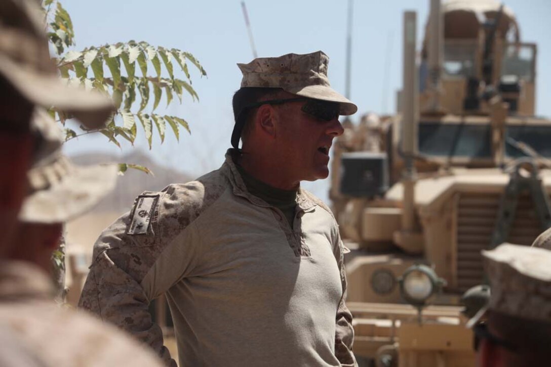 Brig. Gen. John J. Broadmeadow, Commanding General, 1st Marine Logistics Group (Forward), talks to Marines and sailors with Personal Security Detachment, 1st MLG (Fwd), and other convoy members at Forward Operating Base Zeebrugge before driving back to Camp Leatherneck, Afghanistan, Aug. 1. â€œAs the leader of the MLG, itâ€™s important for me to understand what our Marines go through, and I need to see that first hand myself,â€ said Brig. Gen. Broadmeadow. â€œWhat the PSD does for me, it allows me to experience what our Marines experience day in and day out.â€