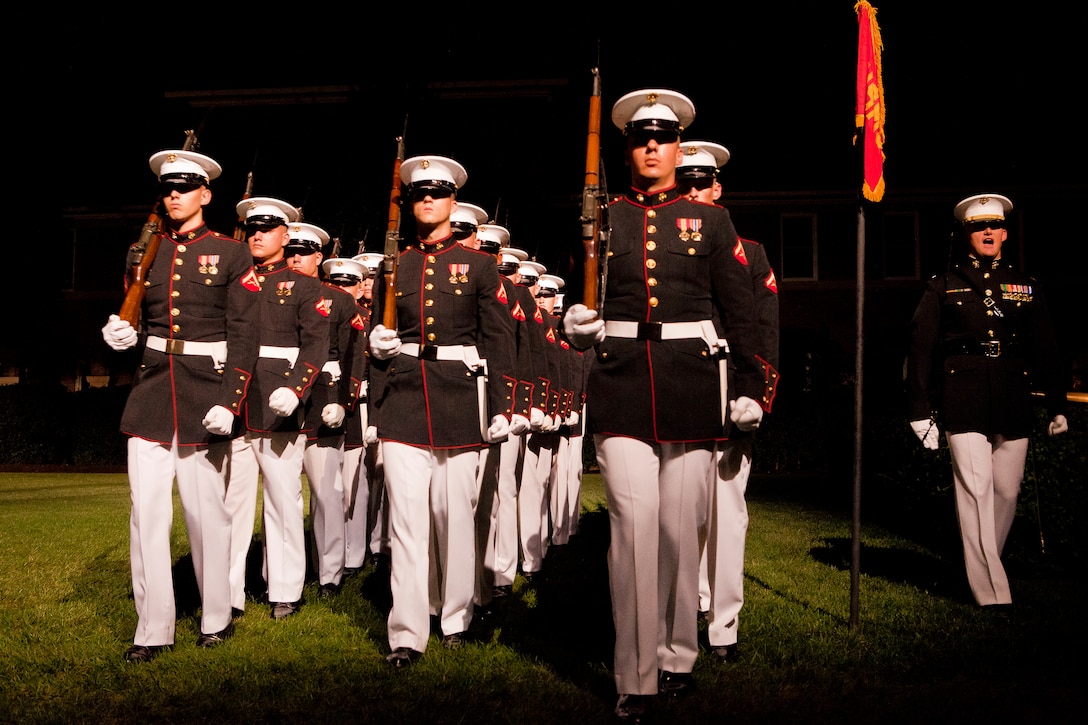 Marine Barracks Washington Marines march pass in review during a Friday Evening Parade at the Barracks Aug. 31.
