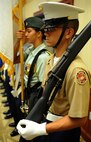 A multi-school Junior Reserve Officers’ Training Crops drill team stands at attention prior to the presentation of The Colors to open up the event 11th Anniversary of the Joint Venture Education Forum Annual Meeting, held at the Ford Island Conference Center, Ford Island, Hawaii Aug. 30, 2012. The JVEF mission is to provide continuous coordination through partnerships and open dialogue, in order to promote an understanding of and implement initiatives to address the needs of military children and families and to facilitate support for Hawaii's public school students. (U.S. Air Force photo/Tech. Sgt. Jerome S. Tayborn)
