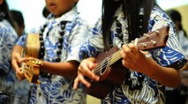 The keiki ukulele band "Na Kamali`i O Iliahi" from Iliahi Elementary School in Wahiawa performing at the 11th Anniversary of the Joint Venture Education Forum Annual Meeting, held at the Ford Island Conference Center, Ford Island, Hawaii Aug. 30, 2012. The JVEF mission is to provide continuous coordination through partnerships and open dialogue, in order to promote an understanding of and implement initiatives to address the needs of military children and families and to facilitate support for Hawaii's public school students. (U.S. Air Force photo/Tech. Sgt. Jerome S. Tayborn)
