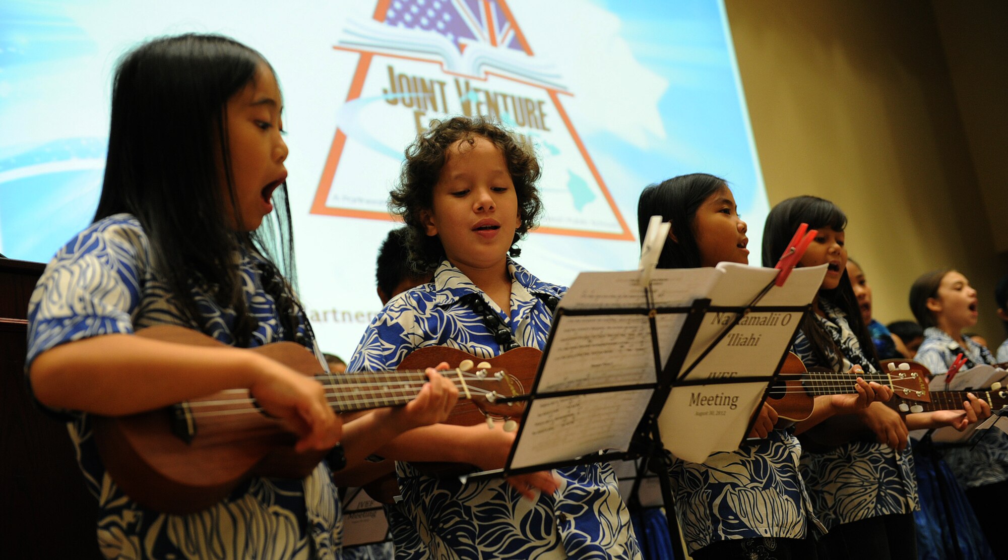 The keiki ukulele band "Na Kamali`i O Iliahi" from Iliahi Elementary School in Wahiawa performing at the 11th Anniversary of the Joint Venture Education Forum Annual Meeting, held at the Ford Island Conference Center, Ford Island, Hawaii Aug. 30, 2012. The JVEF mission is to provide continuous coordination through partnerships and open dialogue, in order to promote an understanding of and implement initiatives to address the needs of military children and families and to facilitate support for Hawaii's public school students. (U.S. Air Force photo/Tech. Sgt. Jerome S. Tayborn)
