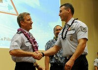 Gen. Herbert J. “Hawk” Carlisle, Pacific Air Forces commander, at the 11th Joint Venture Education Forum Annual Meeting, presented coins to approximately 80 school volunteers at the Ford Island Conference Center, Ford Island, Hawaii, Aug. 30, 2012.  The JVEF mission is to provide continuous coordination through partnerships and open dialogue, in order to promote an understanding of and implement initiatives to address the needs of military children and families and to facilitate support for Hawaii's public school students. (U.S. Air Force photo/Tech. Sgt. Jerome S. Tayborn)