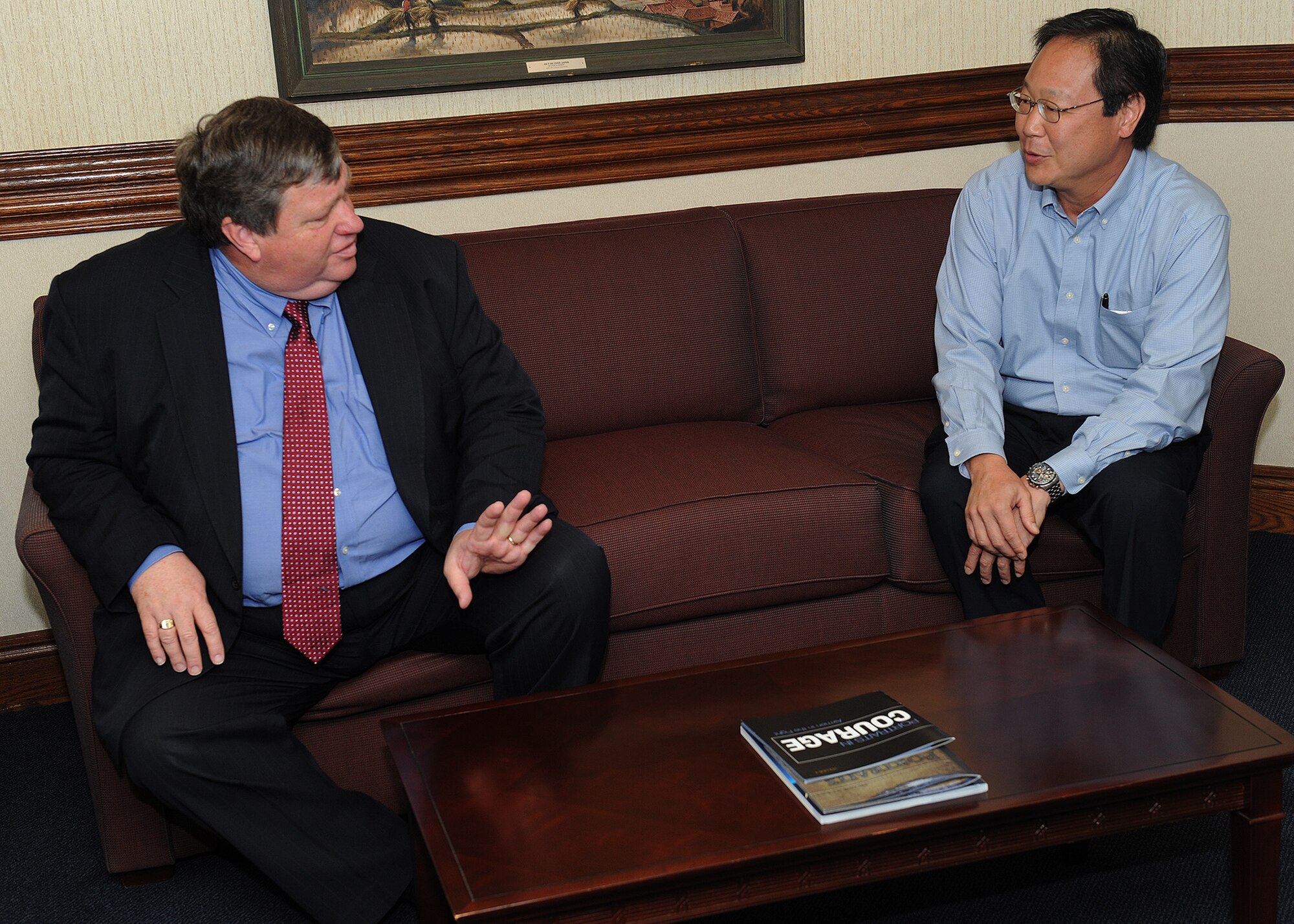 Peter Bodde, the U.S. Ambassador to Nepal, talks with Brian Woo, Pacific Air Forces political advisor at the PACAF headquarters building on Joint Base Pearl Harbor-Hickam, Hawaii, Sept. 5, 2012. Bodde visited PACAF for a brief office call with Gen. Herbert J. “Hawk” Carlisle, PACAF commander. (U.S. Air Force photo/Tech. Sgt. Jerome S. Tayborn)