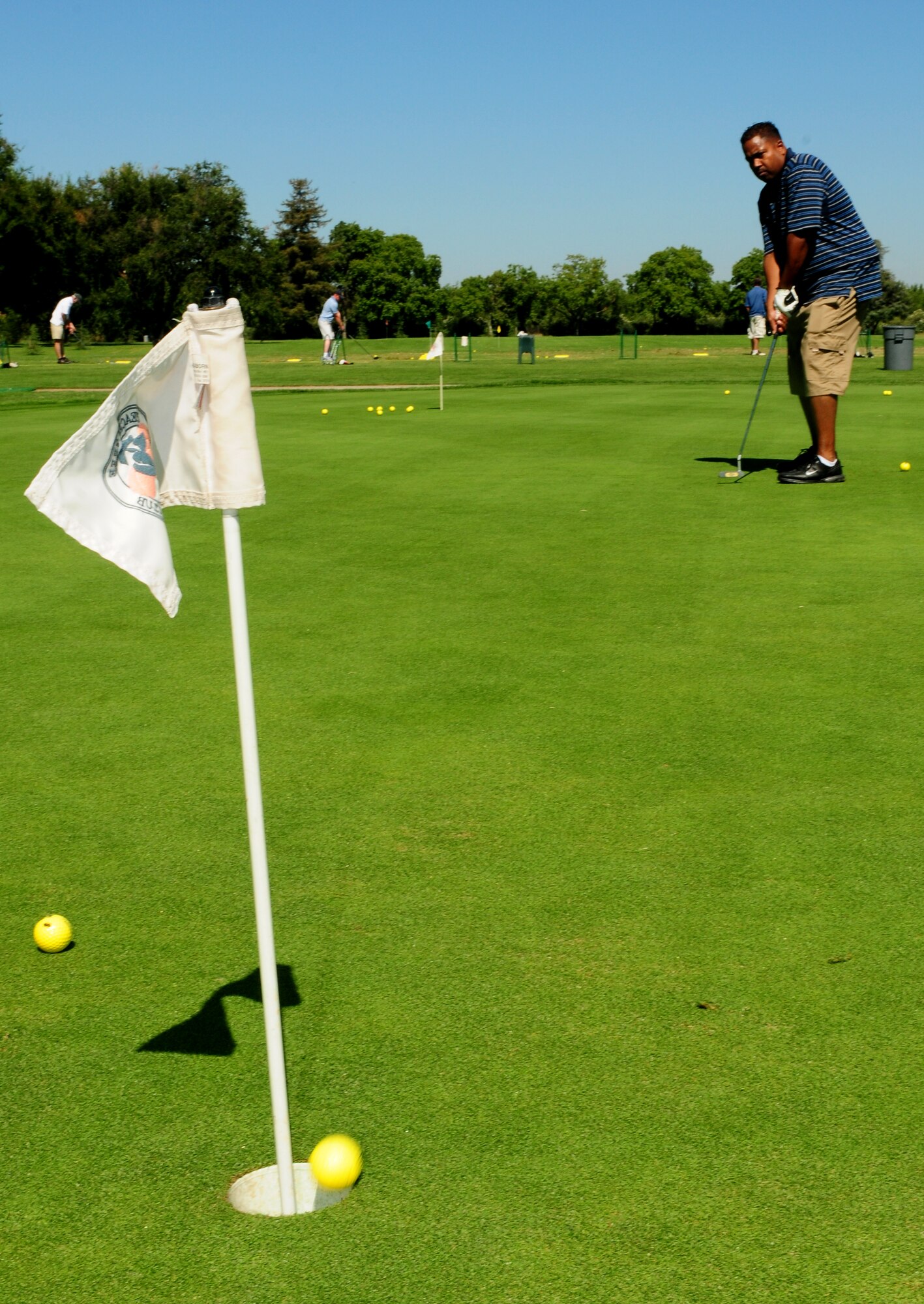 Master Sgt. Kenneth Bellard practices putting for the Beale Liaison Group golf tournament at Peach Tree Golf Club Marysville, Calif., September 7, 2012. The 9th Reconnaissance wing commander, Col. Phil Stewart was the guest speaker at the 4th annual BLG golf tournament. (U.S. Air Force photo by Senior Airman Allen Pollard)