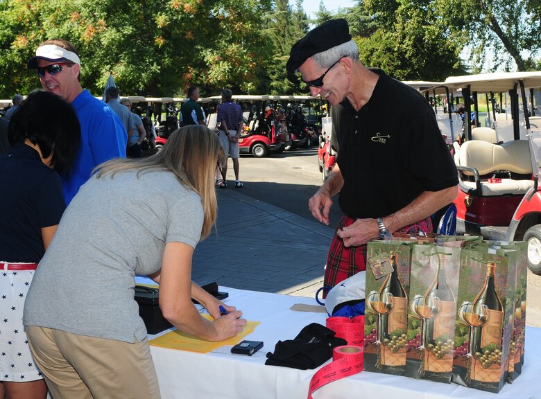 Maj. Gen. Robert P. "Bob" Otto registers for the Beale Liaison Group golf tournament at Peach Tree Golf Club Marysville, Calif., September 7, 2012. Otto is the commander of the Air Force Intelligence, Surveillance and Reconnaissance Agency at Lackland Air Force Base, Texas. (U.S. Air Force photo by Senior Airman Allen Pollard)