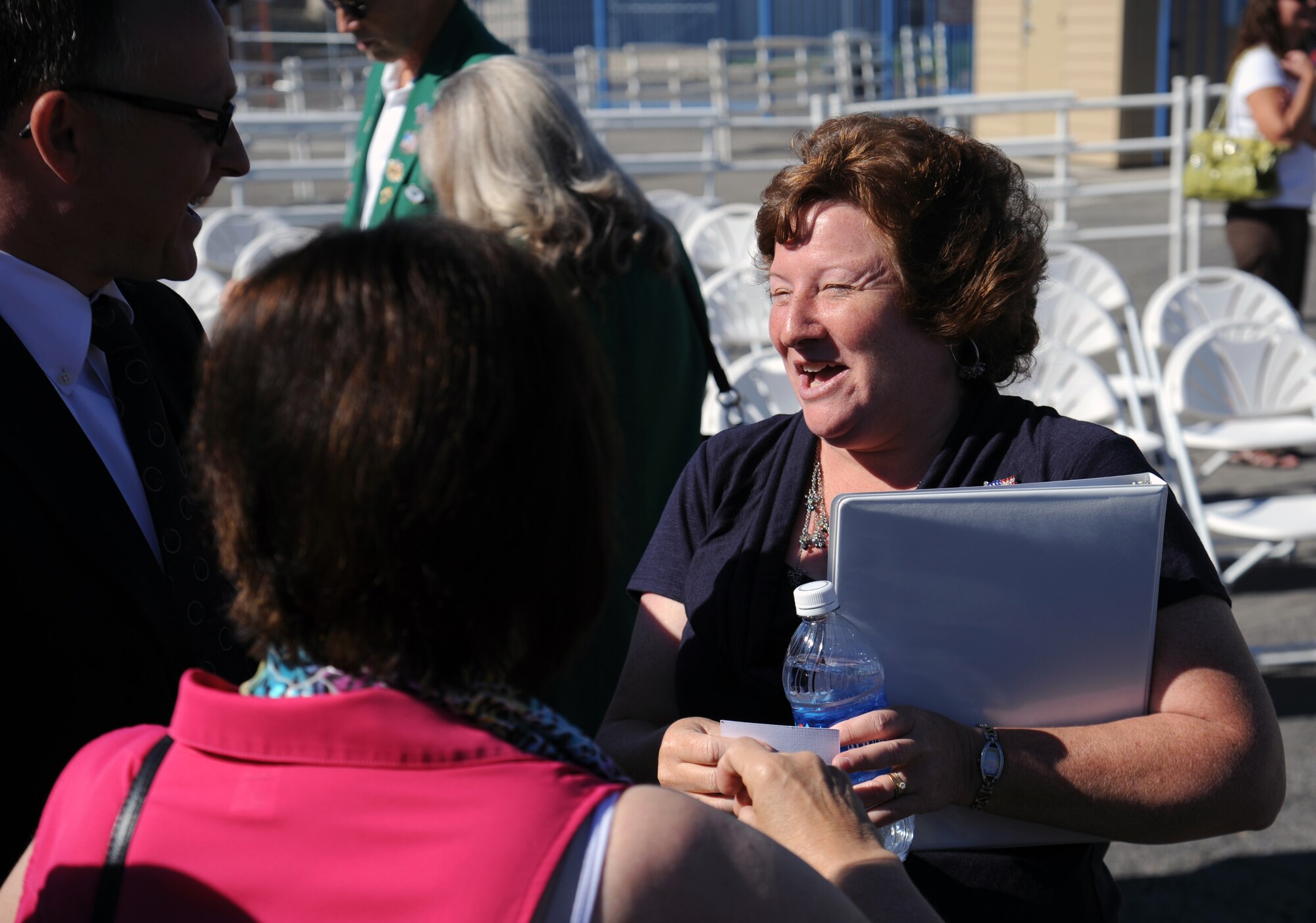 Jill Newberry, wife of Col. Brian Newberry, 92nd Air Refueling Wing commander, talks with local and state government officials at the opening ceremonies of the 61st Annual Spokane County Interstate Fair in Spokane, Wash., Sept. 7, 2012. The colonel’s wife has been very active interfacing with community members since the couple arrived at Fairchild Aug. 6. (U.S. Air Force photo by Senior Airman Benjamin Stratton)