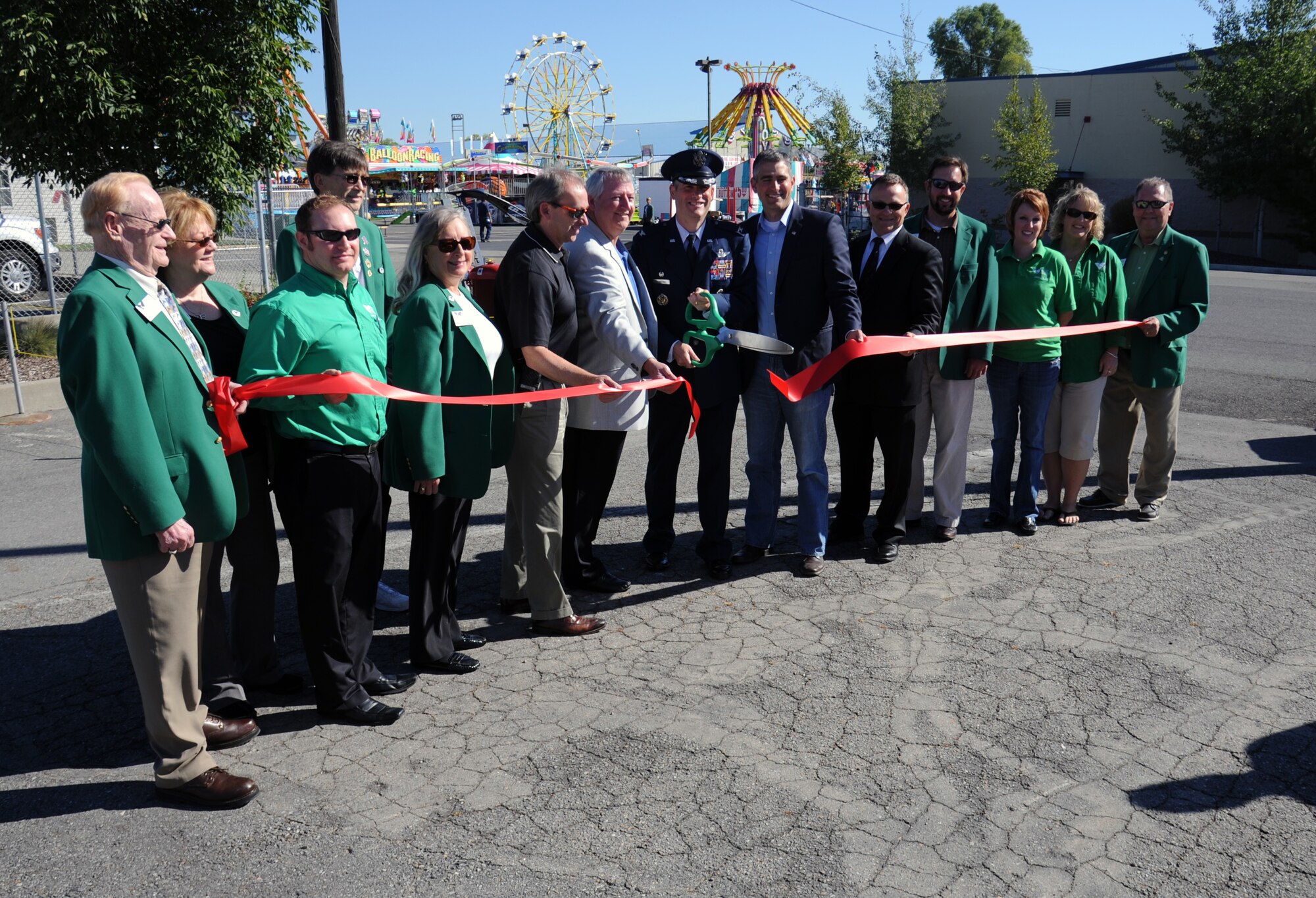 Col. Brian Newberry, 92nd Air Refueling Wing commander, along with local, state and federal government officials cut the ribbon for the opening ceremonies of the 61st Annual Spokane County Interstate Fair in Spokane, Wash., Sept. 7, 2012. Last year’s fair attracted more than 189,000 visitors and is expected to meet or exceed that this year. (U.S. Air Force photo by Senior Airman Benjamin Stratton)