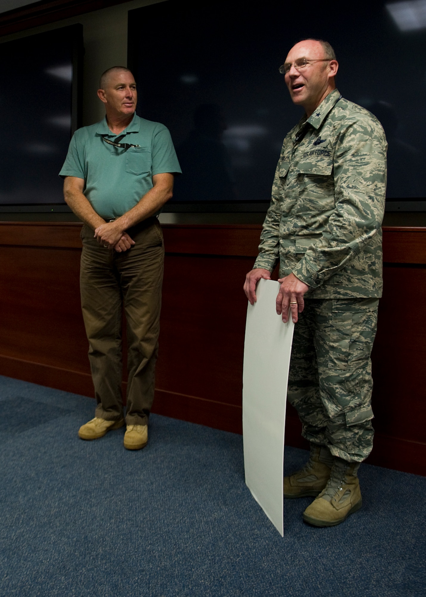 U.S. Air Force Brig. Gen. Michael Kingsley, Air Force Special Operations Command vice commander, speaks about William Walter, AFSOC program analyst, during a ceremony held at the AFSOC headquarters building on Hurlburt Field, Fla., Sept. 5, 2012. Walter submitted an idea to refurbish five 40mm M2A1 guns found on Nellis Air Force Base, Nev. and saved the Air Force $607,000 to $2.36 million. (U.S. Air Force photo/Airman 1st Class Christopher Williams)