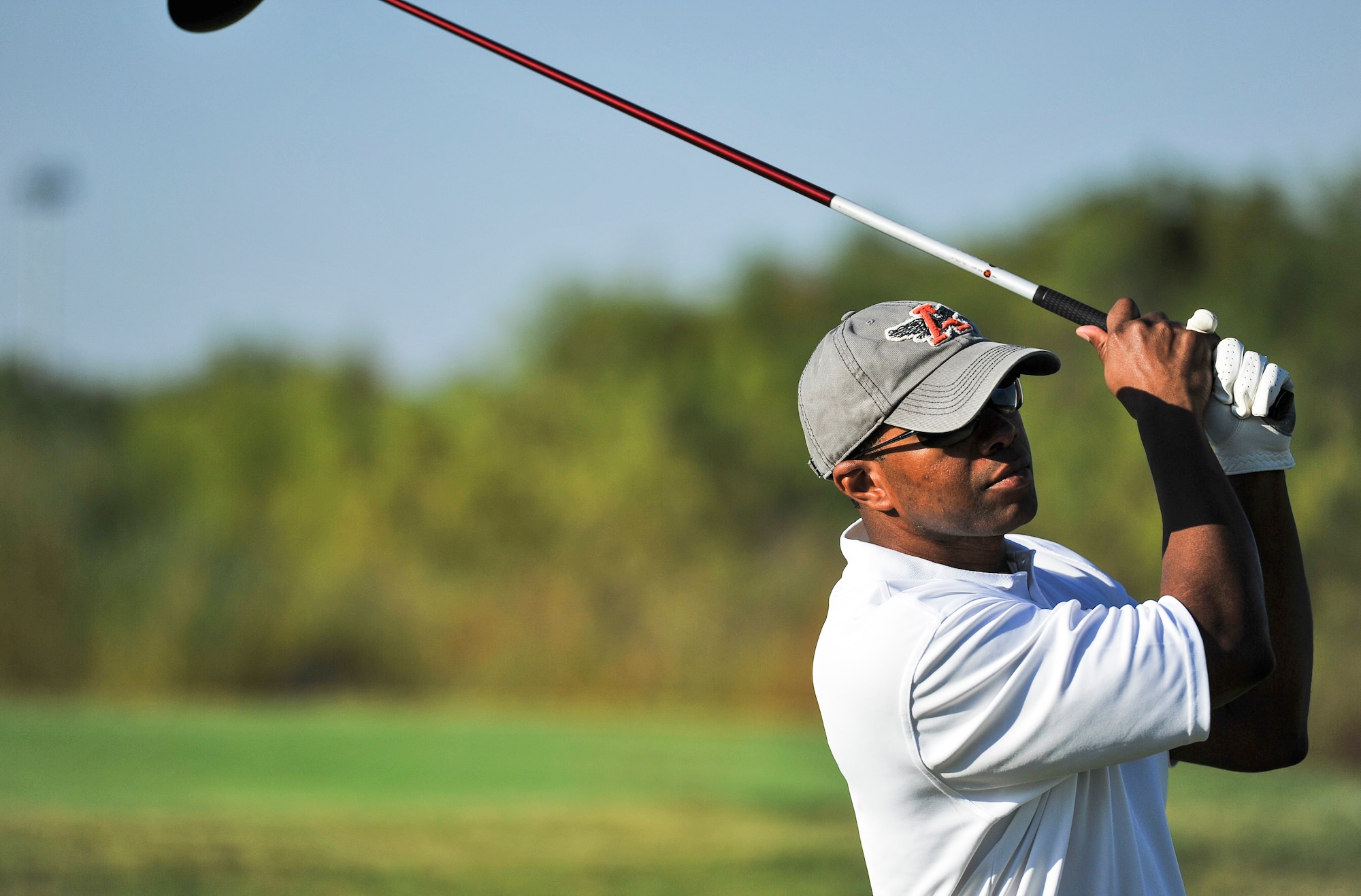 SAN ANGELO, Texas--Maj. Christopher Robinson, 17th Communications Squadron Commander, watches his ball in the air during the 2012 Friendship Golf Tournament at Quicksand Golf Course Sept. 7. The event was hosted by the San Angelo Chamber of Commerce to help raise funds for the First Sergeant's Council to support Operation Warmheart and other base-wide programs that support service members and their families during deployments and emergencies. (U.S. Air Force Photo /Airman 1st Class Michael Smith)