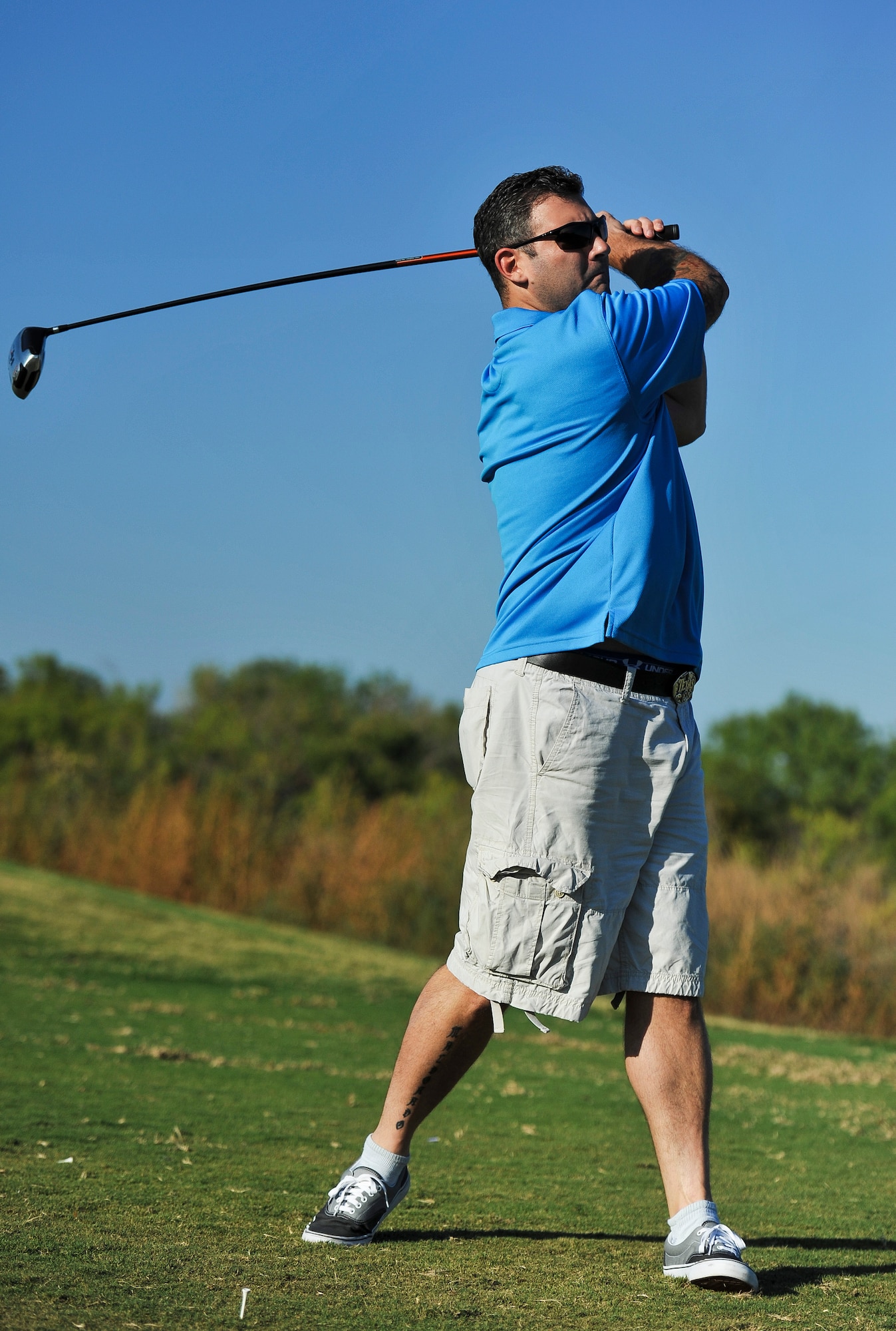 SAN ANGELO, Texas--Tech. Sgt. Gary Maldonado, 17th Communications Squadron, follows through during his golf swing at the 2012 Friendship Golf Tournament at Quicksand Golf Course Sept. 7. The event was hosted by the San Angelo Chamber of Commerce to help raise funds for the First Sergeant's Council to support Operation Warmheart and other base-wide programs that support service members and their families during deployments and emergencies. (U.S. Air Force Photo /Airman 1st Class Michael Smith)