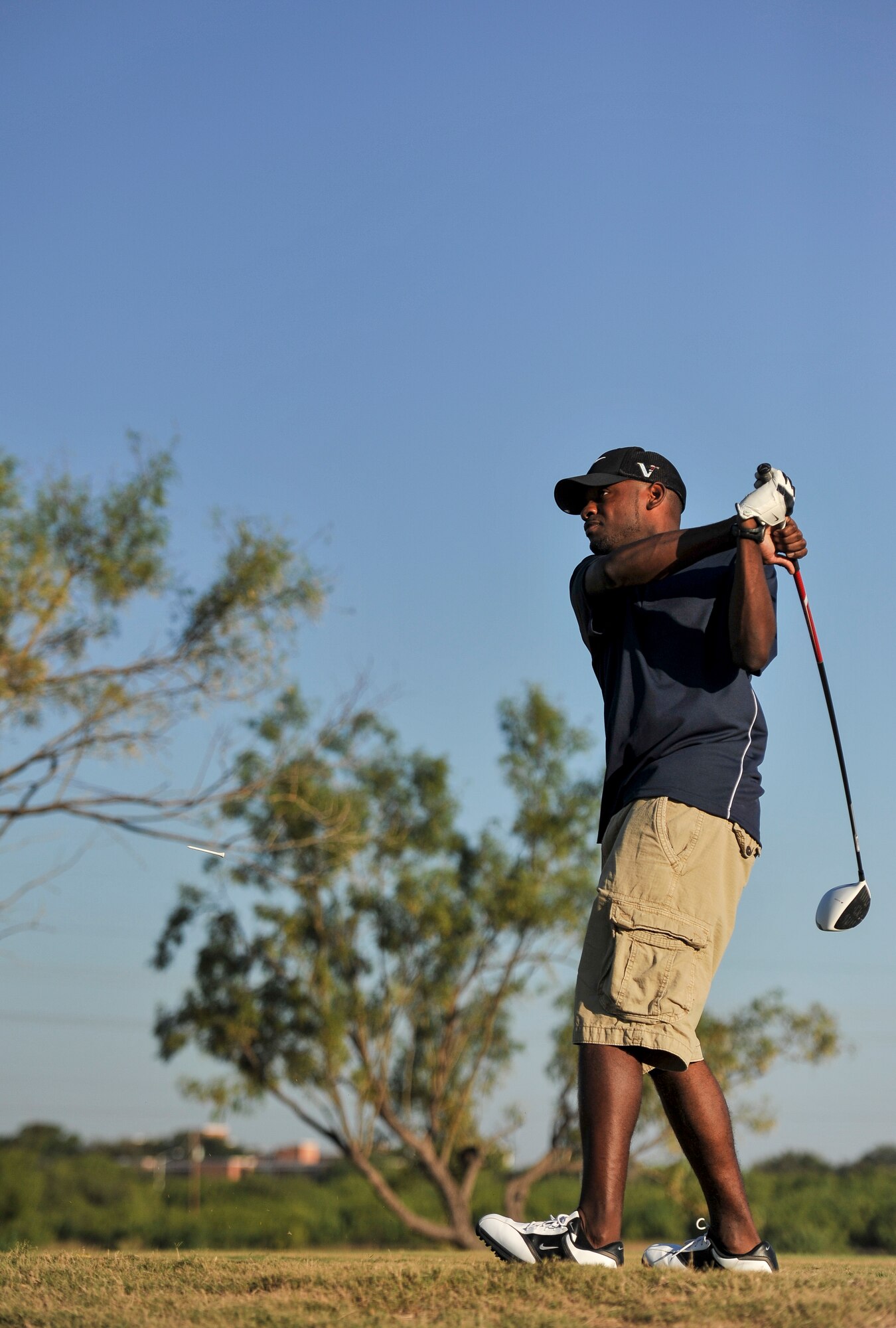 SAN ANGELO, Texas--Woodrow Rorie, 17th Comptroller Squadron, follows through during his golf swing at the 2012 Friendship Golf Tournament at Quicksand Golf Course Sept. 7. The event was hosted by the San Angelo Chamber of Commerce to help raise funds for the First Sergeant's Council to support Operation Warmheart and other base-wide programs that support service members and their families during deployments and emergencies. (U.S. Air Force Photo /Airman 1st Class Michael Smith)