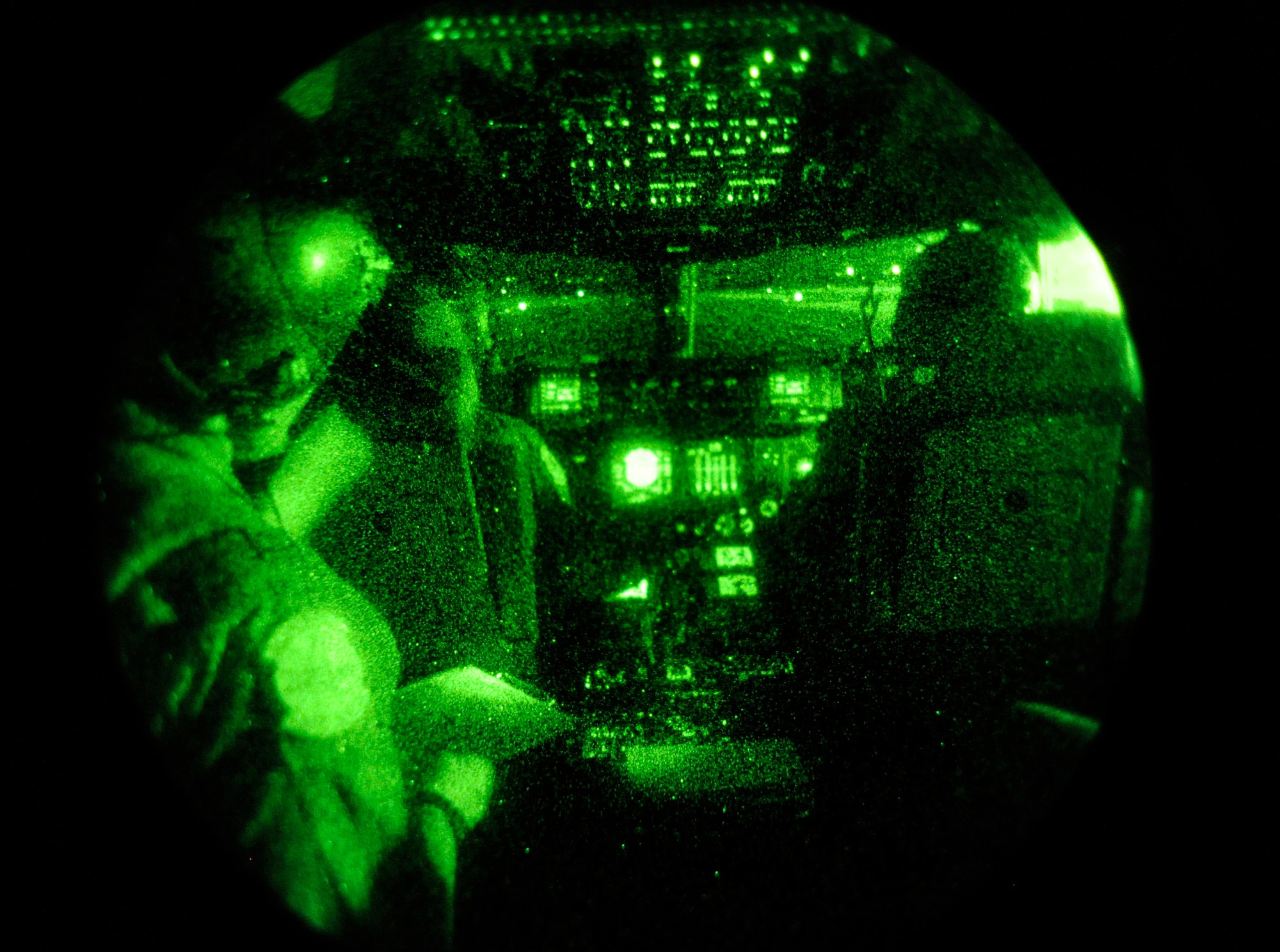 Air Force captains Allin Oberlin, Zach Deshetler and Thomas Star, 517th Airlift Squadron C-17 Globemaster III cargo plane pilots, fly their C-17 during night training over Joint Base Elmendorf-Richardson, Aug. 23, 2012. C-17 aircraft from JBER support a variety of missions around the world, many of which include dropping U.S. Army paratroopers. (U.S. Air Force photo by Staff Sgt. Zachary Wolf)