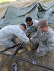 MINOT AIR FORCE BASE, N.D. – Airmen from the 91st Missile Security Forces Squadron work together to build a temper tent, during a Leadership Reaction Course, here August 29. Members of the squadron partook in a training course designed to teach leadership skills to lower-ranking Airmen by placing them in charge of obstacles and challenging tasks. (U.S. Air Force photo/Senior Airman Jose L. Hernandez)