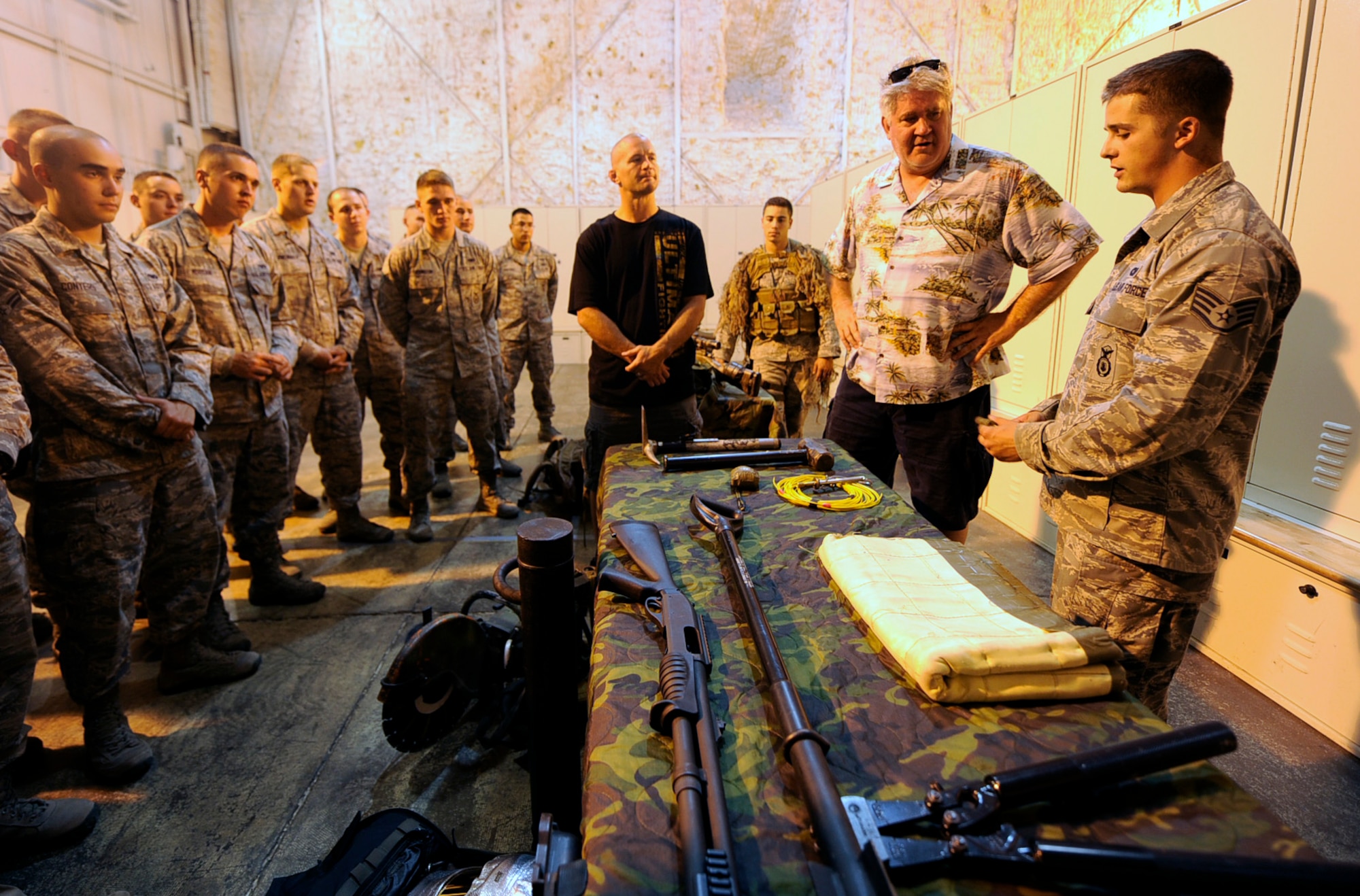 MINOT AIR FORCE BASE, N.D. -- World champion cage fighter Chris Lytle and renowned comedian and musician Jim Peters, learn about the mission of the 91st Security Forces Group Tactical Response Force, here Aug. 28. The pair had a chance to tour the base as part of the continuing Air Force Global Strike Command American300 Never Quit Series Tour. (U.S. Air Force photo/Senior Airman Jesse Lopez)