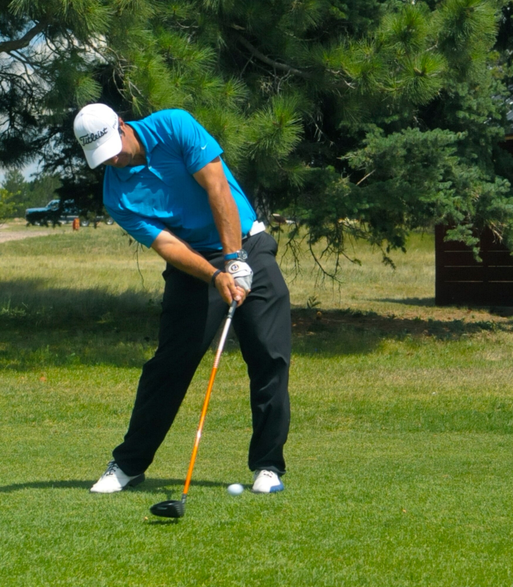 First Lt. Tom Whitney, 319th Missile Squadron deputy missile combat crew commander, drives his ball down the fairway on the F. E. Warren Air Force Base Golf Course Aug. 7. (U.S. Air Force photo by Airman 1st Class Jason Wiese)
