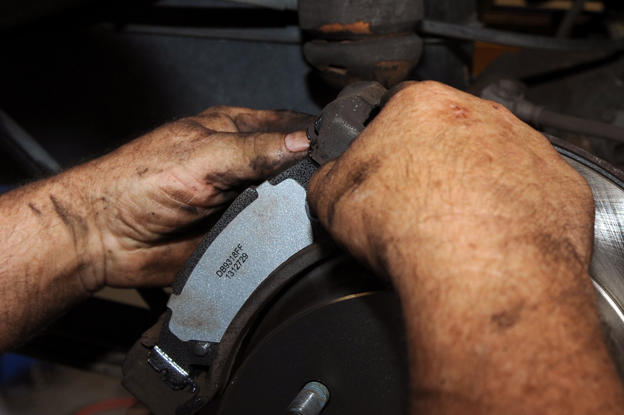 Jerry Cazeault, 4th Force Support Squadron mechanic, installs a new brake pad on a car at the Auto Hobby Shop on Seymour Johnson Air Force Base, N.C., Sept. 6, 2012. The shop staff can order and receive parts the same day for those in need of quick replacements. (U.S. Air Force photo/Airman 1st Class John Nieves Camacho/Released)