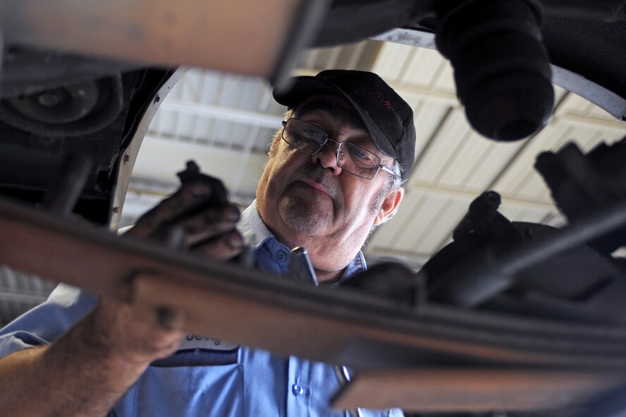 Jerry Cazeault, 4th Force Support Squadron mechanic, examines a brake pad during an inspection at the Auto Hobby Shop on Seymour Johnson Air Force Base, N.C., Sept. 6, 2012. State inspections are offered on a first come-first serve policy without appointments. (U.S. Air Force photo/Airman 1st Class John Nieves Camacho/Released)