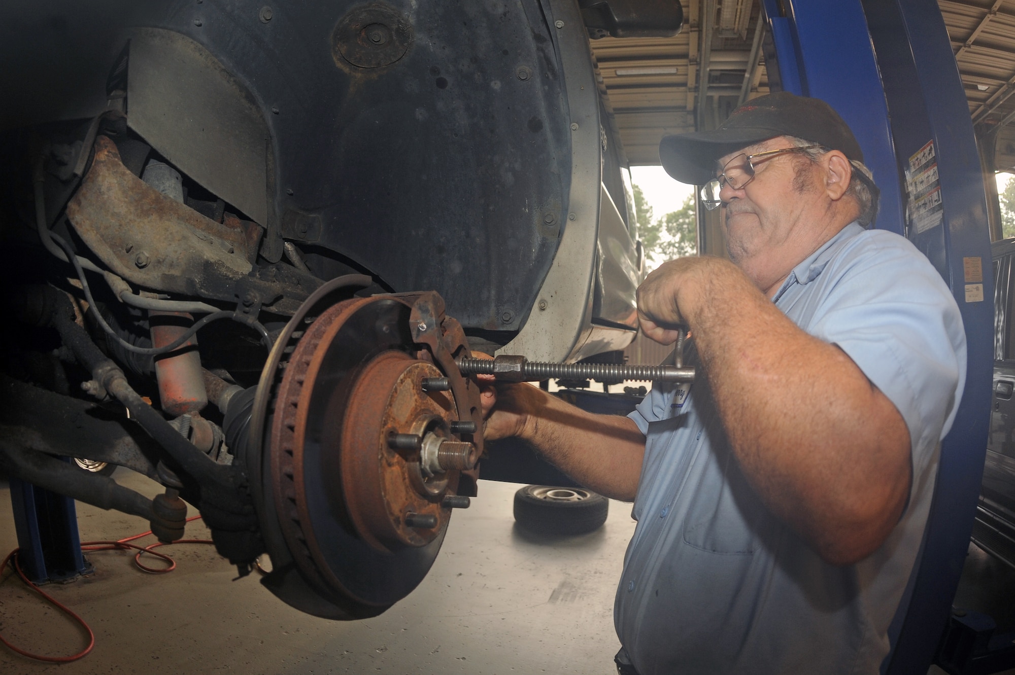 Jerry Cazeault, 4th Force Support Squadron mechanic, takes apart a brake system at the Auto Hobby Shop on Seymour Johnson Air Force Base, N.C., Sept. 6, 2012. The shop staff offers a variety of maintenance services including oil changes, brake repair and wheel alignments. (U.S. Air Force photo/Airman 1st Class John Nieves Camacho/Released)