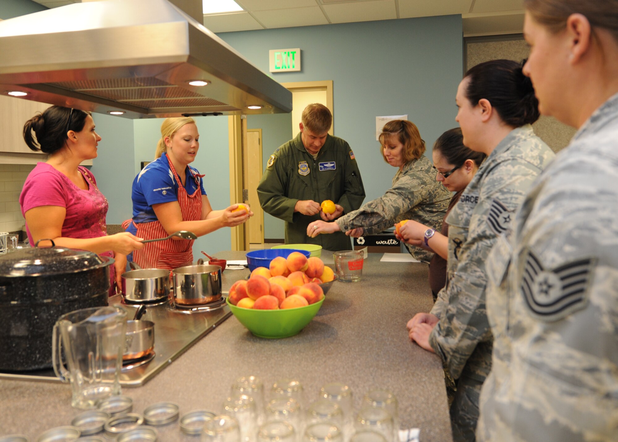 Alyson Kresser, 92nd Aerospace Medicine Squadron Health and Wellness Center registered dietitian, teaches Team Fairchild members how to preserve peaches at Fairchild Air Force Base, Wash., Aug. 22, 2012. The HAWC hosts other group classes, individualized programs and resources. (U.S. Air Force photo by Staff Sgt. Michael Means)
