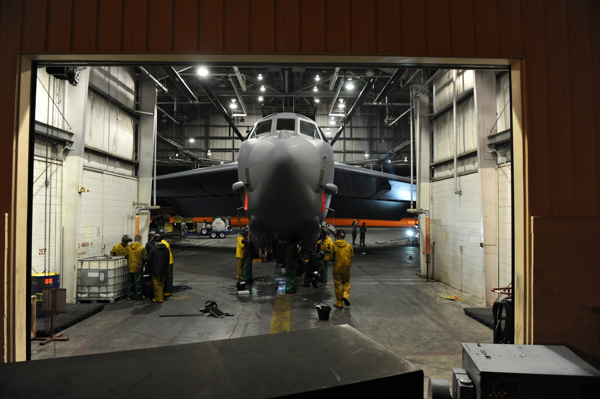 Airmen from the 2nd Maintenance Squadron scrub the bottom of a B-52H Stratofortress in the corrosion hangar on Barksdale Air Force Base, La., Aug. 22. Before every phase inspection, B-52s are cleaned to make the inspection process easier and more efficient. It typically takes 32 Airmen 12 hours to wash the aircraft. (U.S. Air Force photo/Airman 1st Class Micaiah Anthony)(RELEASED)