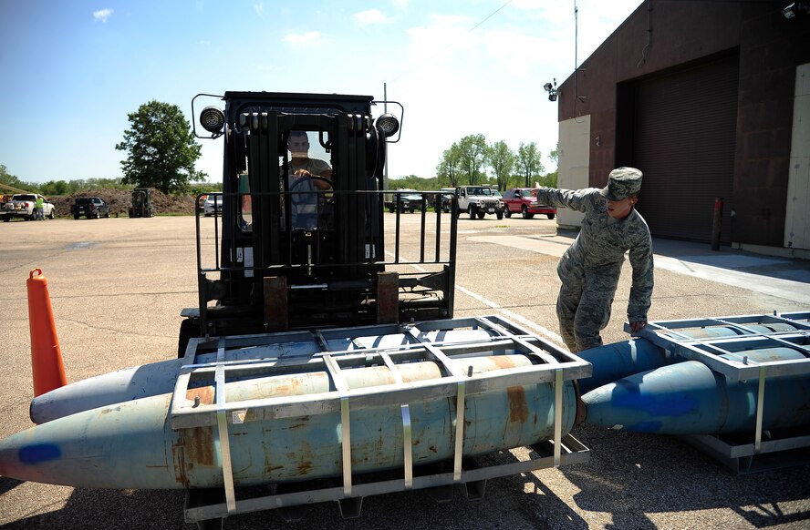 Airmen 1st Class Joe Villines and Corey Clark, 509th Munitions Squadron, work together during the munitions handling rodeo section of the Air Force Global Strike Command Challenge at Whiteman Air Force Base, Mo., Sept. 5. Villines scored a 49 of 50 possible points during the munitions handling portion of the challenge. Clark followed Villines in competing in the same portion of the challenge, scoring 50 of 50 possible points and completing the task in 5:48 of the available eight minutes given to complete.  (U.S. Air Force photo/ Senior Airman Cody H. Ramirez)