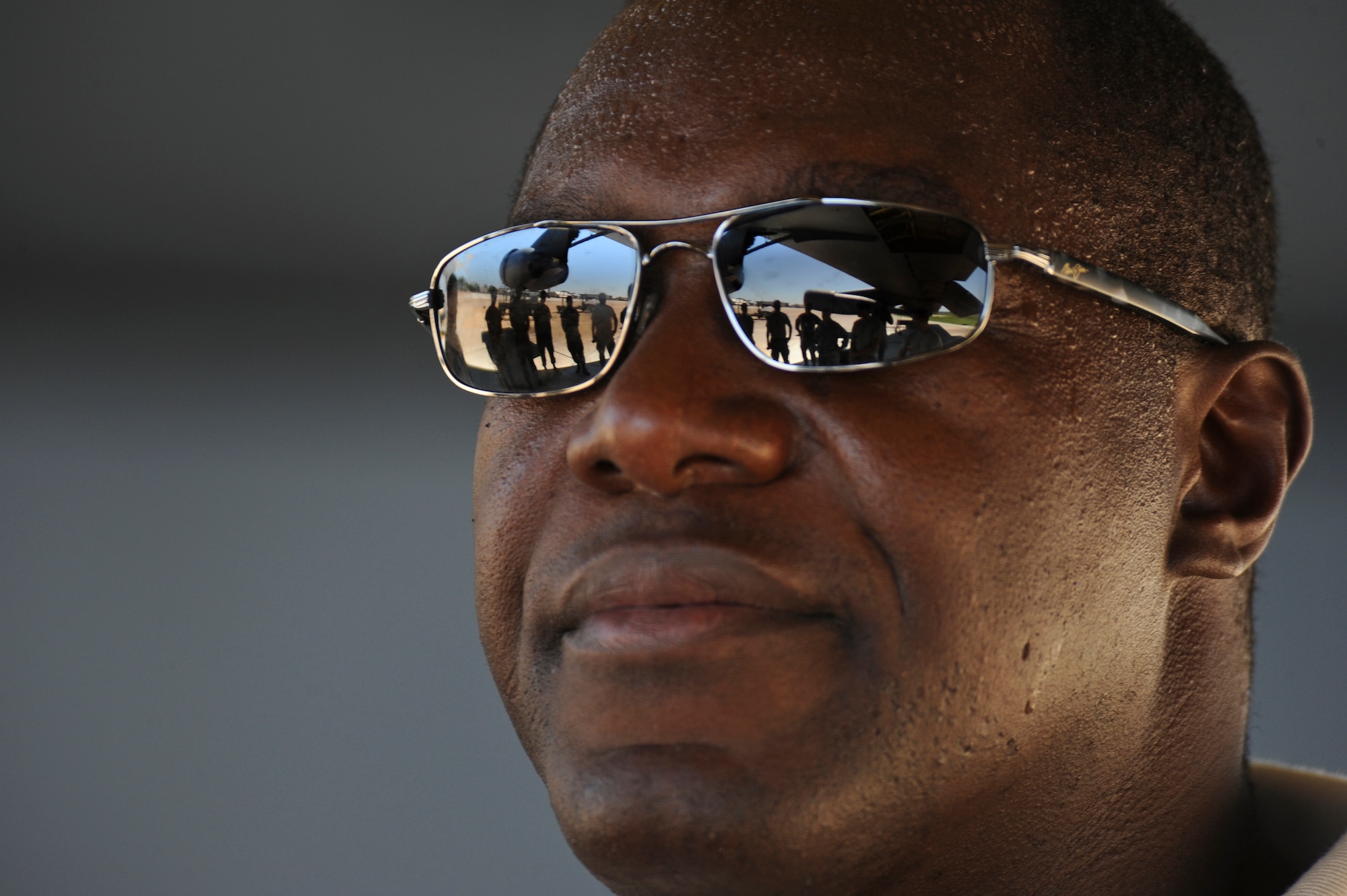 Retired Jamaican Army Capt. Devon Harris, three-time Olympic Jamaican Bobsledder, listens as Robi Powers, American 300 founder, introduces him to Barksdale Airmen on the flightline at Barksdale Air Force Base, La., Sept. 5. Harris and Powers toured the flightline with a Barksdale chaplain to raise morale and handed out popsicles and sports drinks to Airmen. Harris was one of the first Jamaican Bobsledders in Olympic history. (U.S. Air Force photo/Airman 1st Class Micaiah Anthony)(RELEASED)