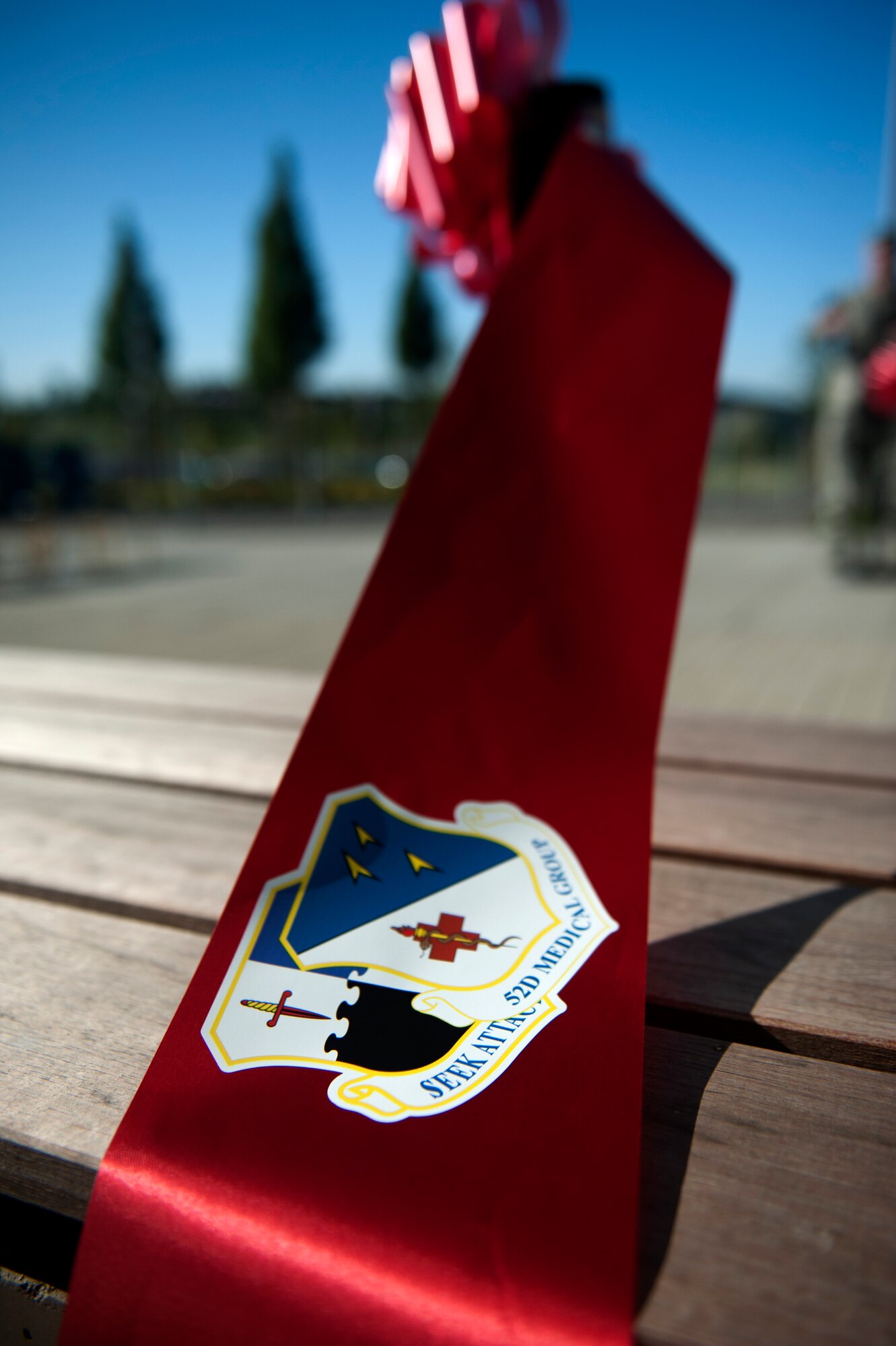 SPANGDAHLEM AIR BASE, Germany – A cut ribbon rests on a bench in front of the new 52nd Medical Group clinic here Sept. 7.  The $30.1 million clinic officially opens Sept. 10 and includes a larger parking lot, a 75,000 square foot building, 23 exam rooms, 218 medical professionals, and new medical equipment and furniture.  (U.S. Air Force photo by Airmen 1st Class Gustavo Castillo/Released)