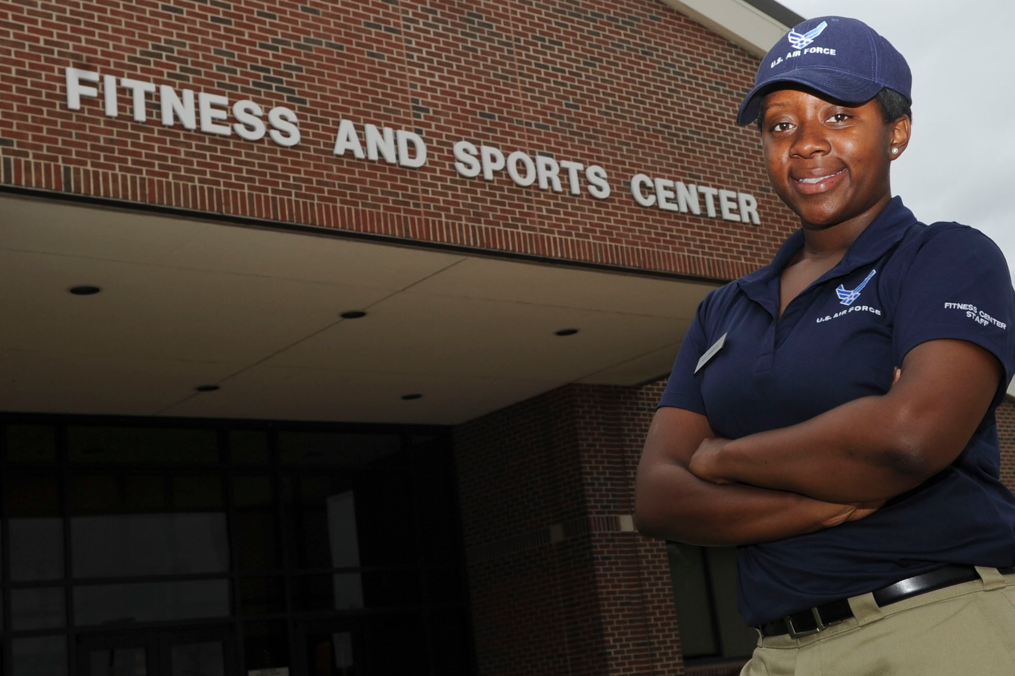 Airman 1st Class Shanique Cameron, 633rd Force Support Squadron fitness specialist, helps people develop workout routines and answers any facility and equipment questions patrons may have. She has been in the Air Force a little more than a year. (U.S. Air Force photo by Staff Sgt. Wesley Farnsworth / Released)