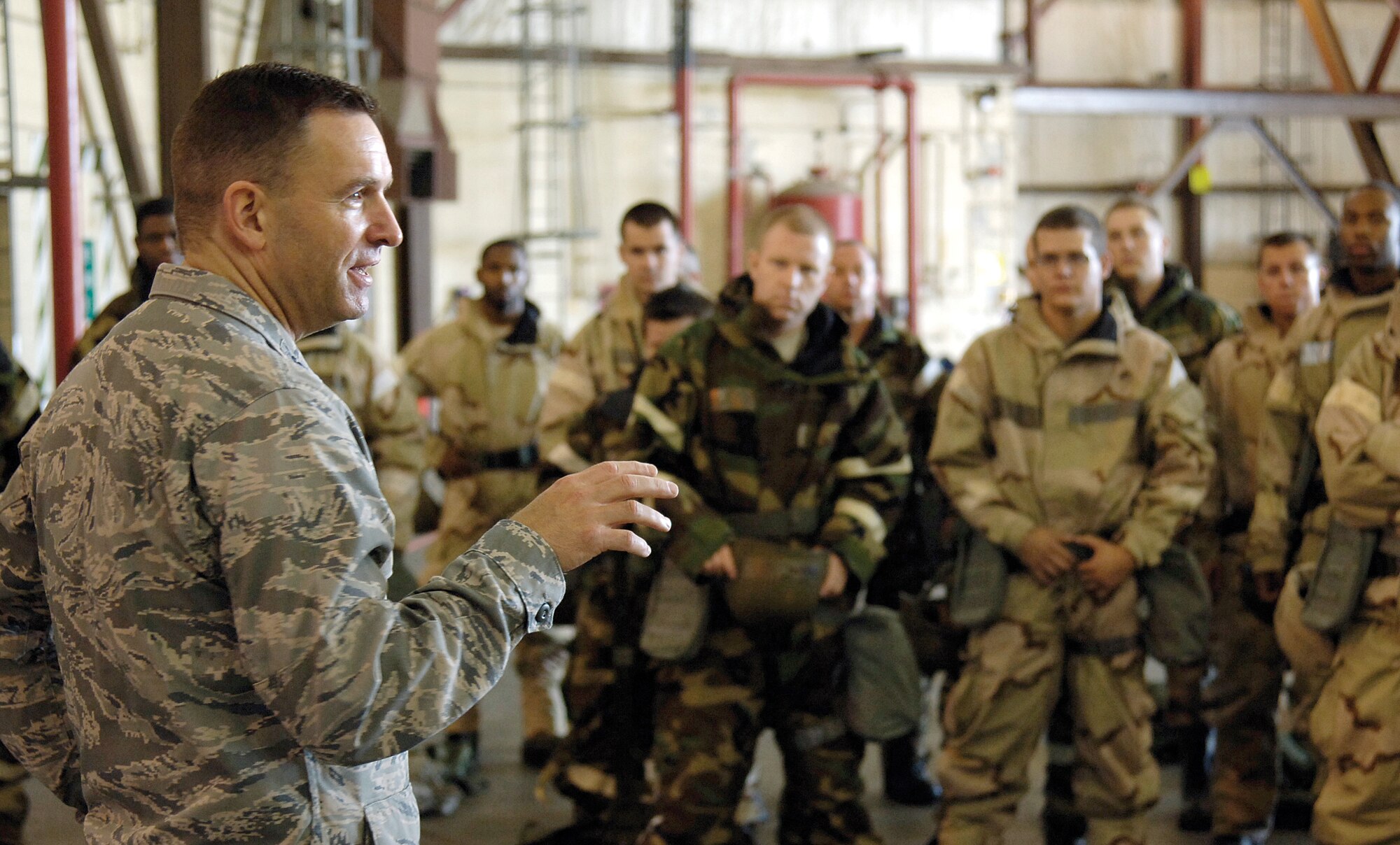 Col. Tom Engle, 552nd Air Control Wing vice commander, addresses wing Airmen before the first half-day session of a two-day Ability to Survive and Operate, or ATSO,  training course held in a wing hangar.  The colonel reminded the Airmen how important this training was.  “We need to train on things we don’t do daily,” he said. “We’re deploying all the time, but we don’t do this. If you don’t know how to do this, it’s a vulnerability,” he stressed. The Airmen rotated through five stations, training how to correctly put on MOPP gear and help others put it on, medical Self-Aid Buddy Care, correct decontamination procedures and how to give a detailed SALUTE report to security personnel about any suspicious people or activities. (Air Force photo by Margo Wright)