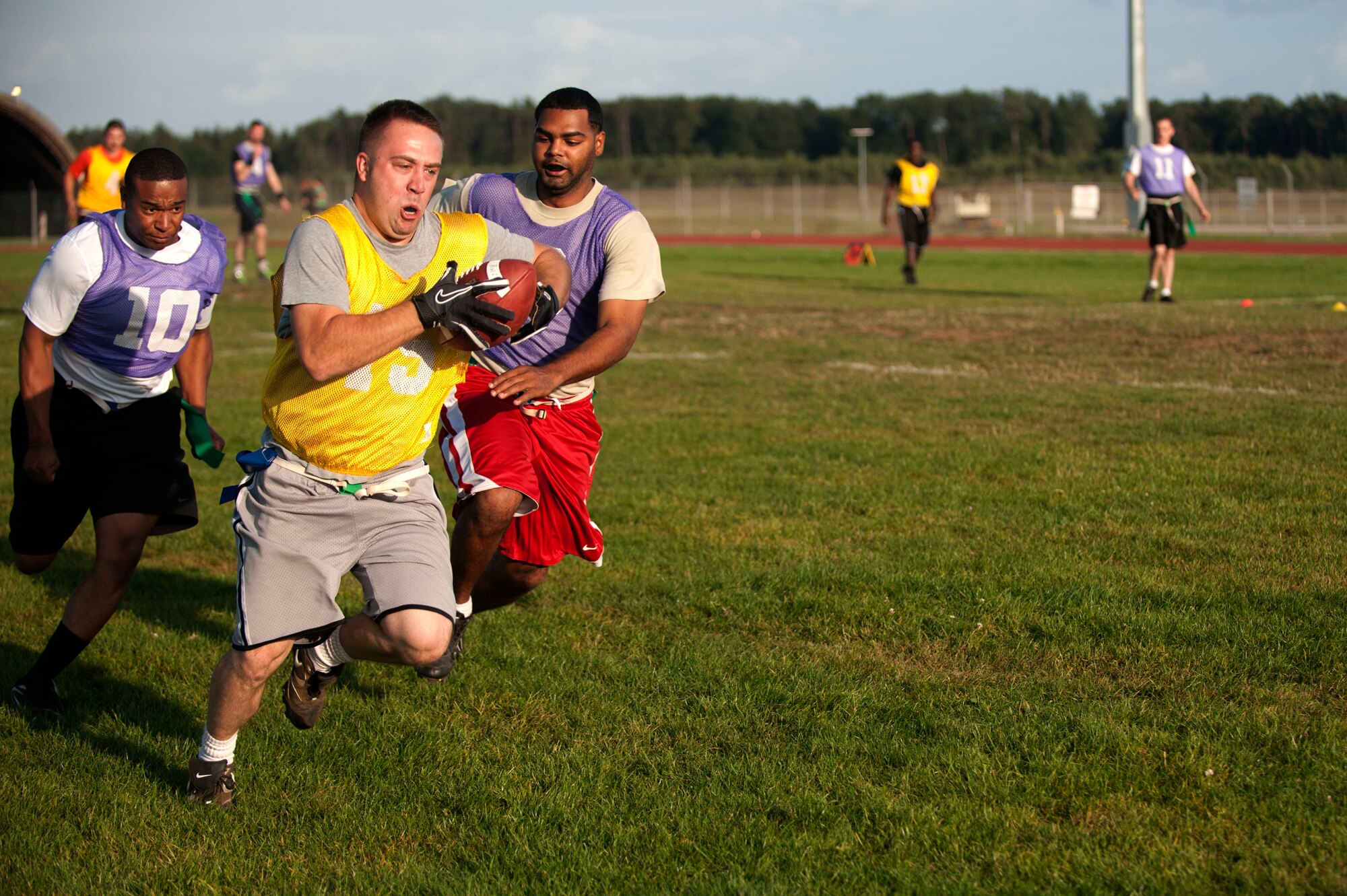 SPANGDAHLEM AIR BASE, Germany – Nathan Denn, 52nd Aircraft Maintenance Squadron NCO in charge of supply, sprints toward the end zone during a flag football game near the Skelton Memorial Fitness Center here Sept. 5.  Denn assisted his team’s first victory of the season by scoring two of the four touchdowns.  The flag football season will continue until Oct. 31, thereafter the top eight teams will compete for the base championship title in a single elimination tournament. (U.S. Air Force photo by Airman 1st Class Gustavo Castillo/Released)
