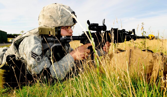 STANTA, Norfolk – Senior Airman Nathan Porrata, 100th Security Forces Squadron, RAF Mildenhall, performs perimeter security for a simulated third country national encampment during a joint U.S. and Royal Air Force exercise Sept. 6, 2012, at Stanford Training Area, Thetford. Porrata was one of several 100th SFS Airmen who provided perimeter security while allowing RAF forces to simulate a raid on the TCN encampment. (U.S. Air Force photo/Senior Airman Ethan Morgan)