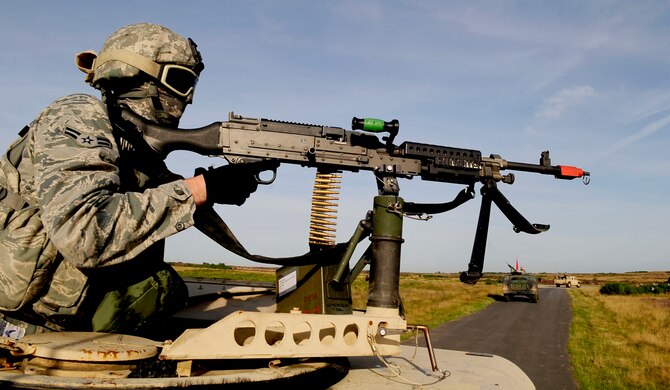 STANTA, Norfolk – An Airman from the 100th Security Forces Squadron, RAF Mildenhall, holds the role of a gunner during a joint U.S. and Royal Air Force exercise Sept. 6, 2012, at Stanford Training Area, Thetford. The exercise was held to prepare the British airmen for an upcoming deployment to Afghanistan along with training 100th SFS Airmen to work better with their RAF counterparts. . (U.S. Air Force photo/Senior Airman Ethan Morgan)