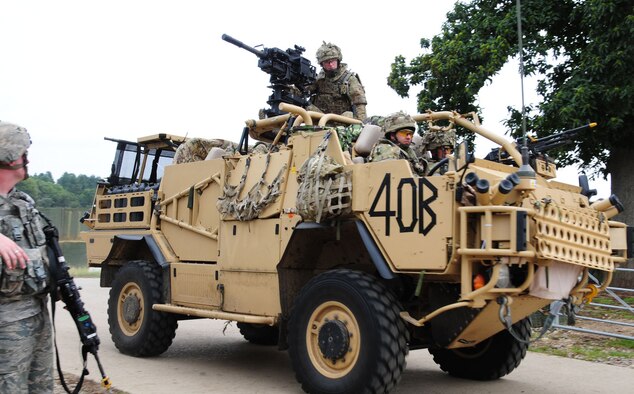 STANTA, Norfolk – British Royal Air Force members from 15 Squadron, RAF Honington, arrive at “Forward Operating Base Oakwood” in an armoured Jackal at Stanford Training Area, Thetford Sept. 4, 2012. Airmen from the 100th Security Forces Squadron worked alongside British troops at STANTA, to help provide realistic training scenarios before the RAF regiments deploy to Afghanistan. (U.S. Air Force photo/Karen Abeyasekere)
