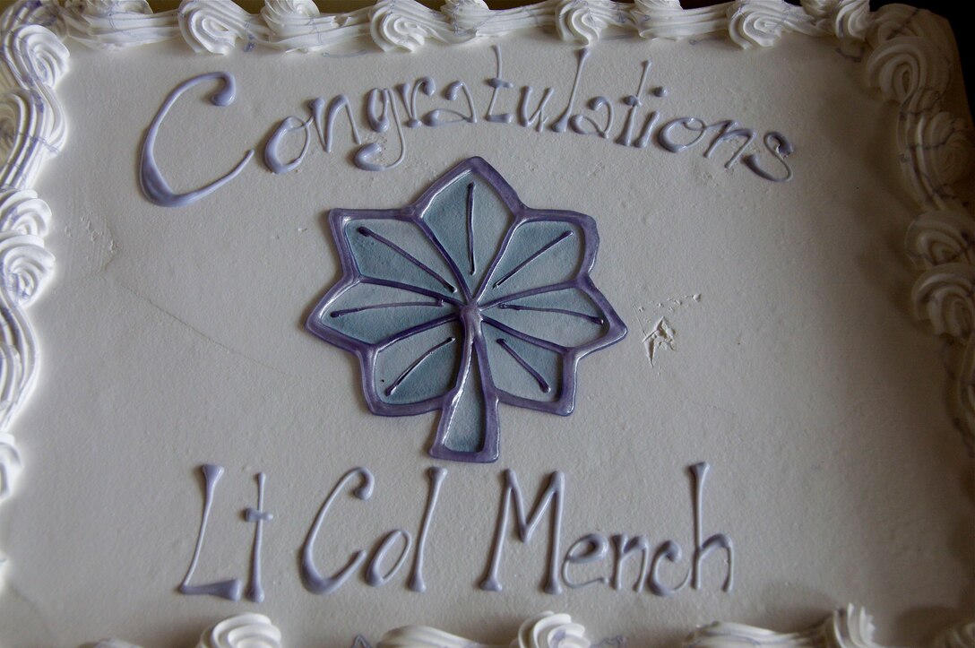 The band booster club provided a cake in celebration of Col. Mench's promotion.