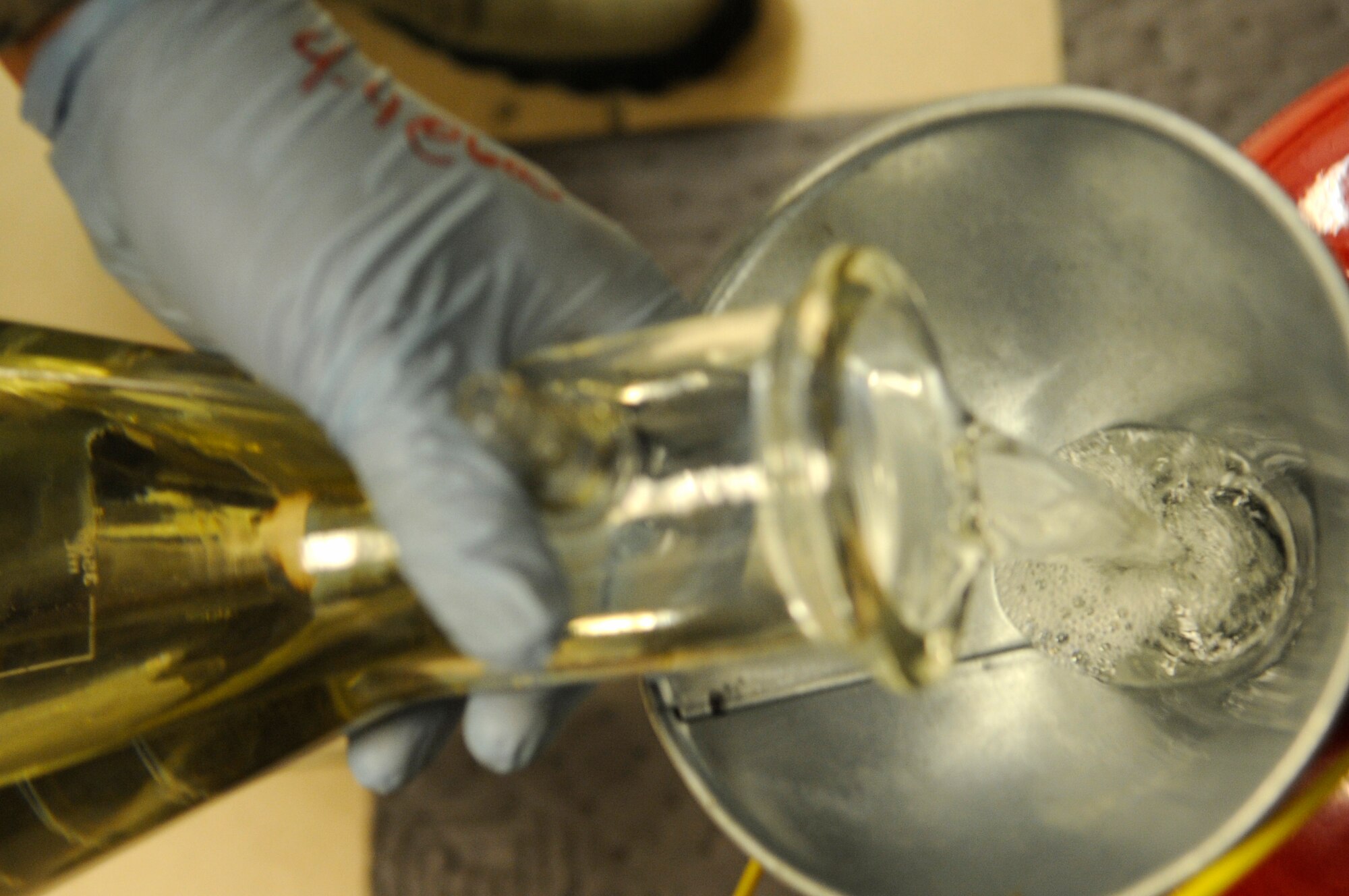Aviation fuel is recycled after being tested at the 8th Logistics Readiness Squadron fuels lab at Kunsan Air Base, Republic of Korea, Sept. 4, 2012. Contaminants and water are some of the things fuels technicians test the fuel for before issuing it out. (U.S. Air Force photo/Senior Airman Brigitte N. Brantley)