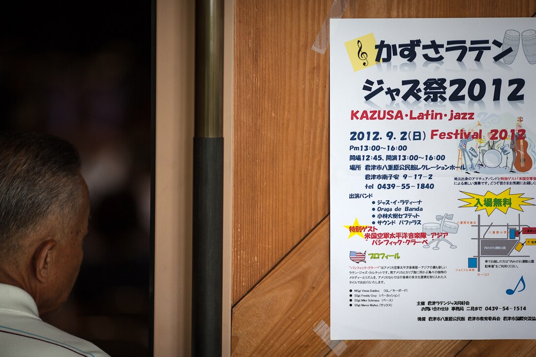 KIMITSU, Japan -- A man enters the hall to see the performances at the KAZUSU Latin Jazz Festival, Kimitsu, Japan, Sept. 2, 2012. Staff needed to set up additonal seating for the aproximately 120 people that attended the concert. (U.S. Air Force photo by Staff Sgt. Josh Voyles)