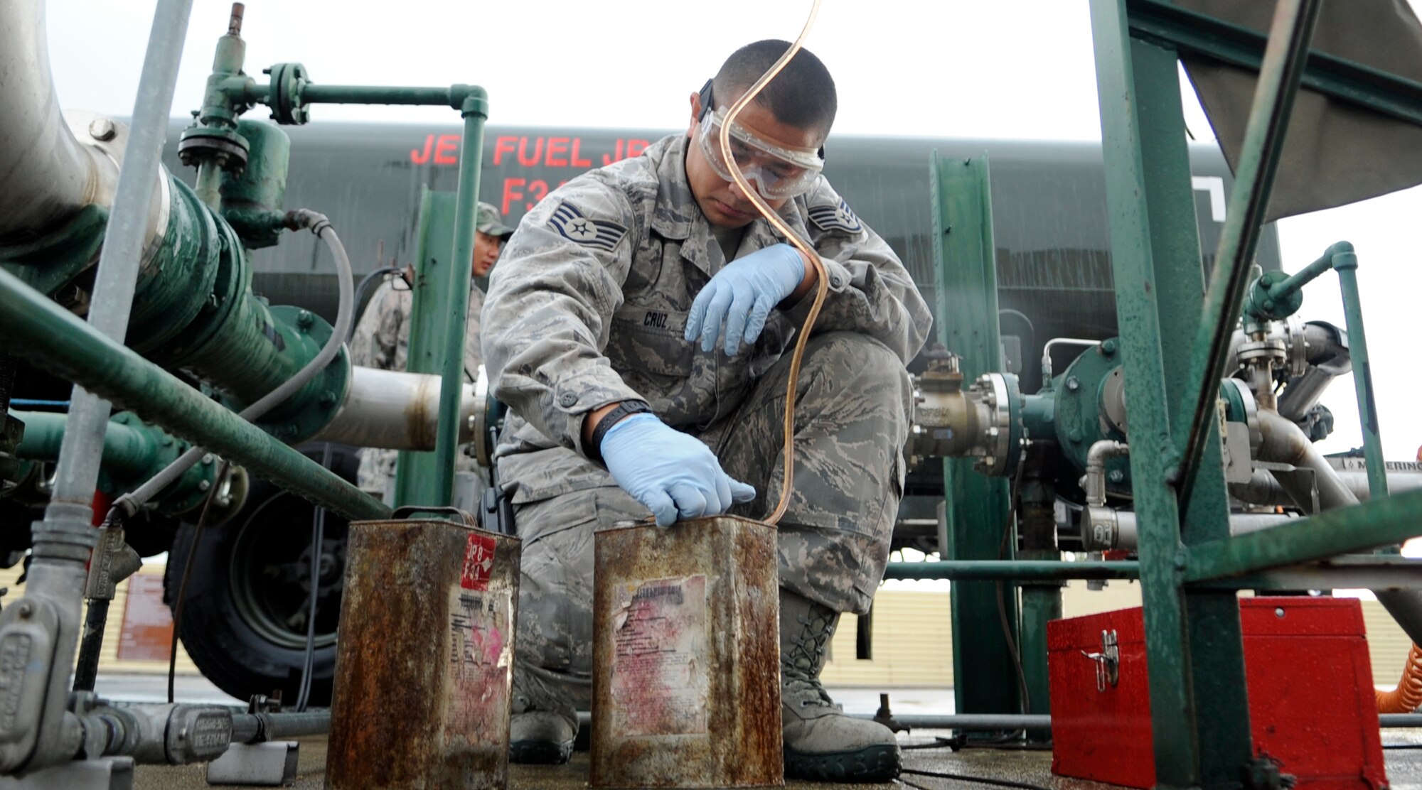 Staff Sgt. Benny Cruz, 8th Logistics Readiness Squadron fuels lab NCO in charge, takes samples of jet fuel from the base supply at Kunsan Air Base, Republic of Korea, Sept. 4, 2012. The petroleum, oil and lubricant flight manages the largest fuels account in the Department of Defense, issuing more than 15 million gallons of fuel a year. (U.S. Air Force photo/Senior Airman Brigitte N. Brantley)