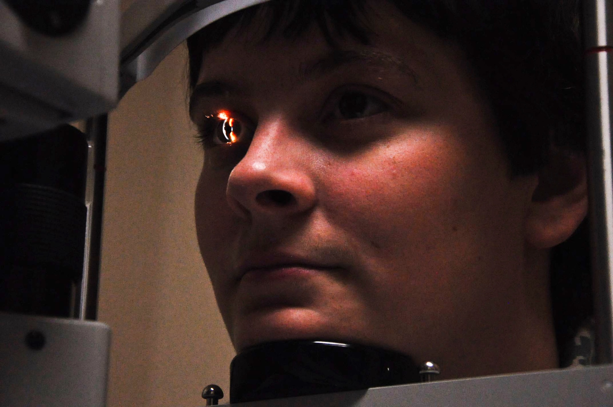 AURORA, Colo. – Senior Airman Megan Littlejohn, 460th Security Forces Squadron, stares into the light as Maj. Dan Gullekson, 460th Medical Operations Squadron Optometry Element chief, conducts an eye exam Sept. 5, 2012, at the Buckley Air Force Base Optometry Clinic. The clinic, which is located in the off-base VA Joint Venture Buckley Clinic in Aurora, Colo., offers eye care ranging from basic eye exams to pre- and post-operative care after refractive surgery. (U.S. Air Force photo by Staff Sgt. Kali L. Gradishar)