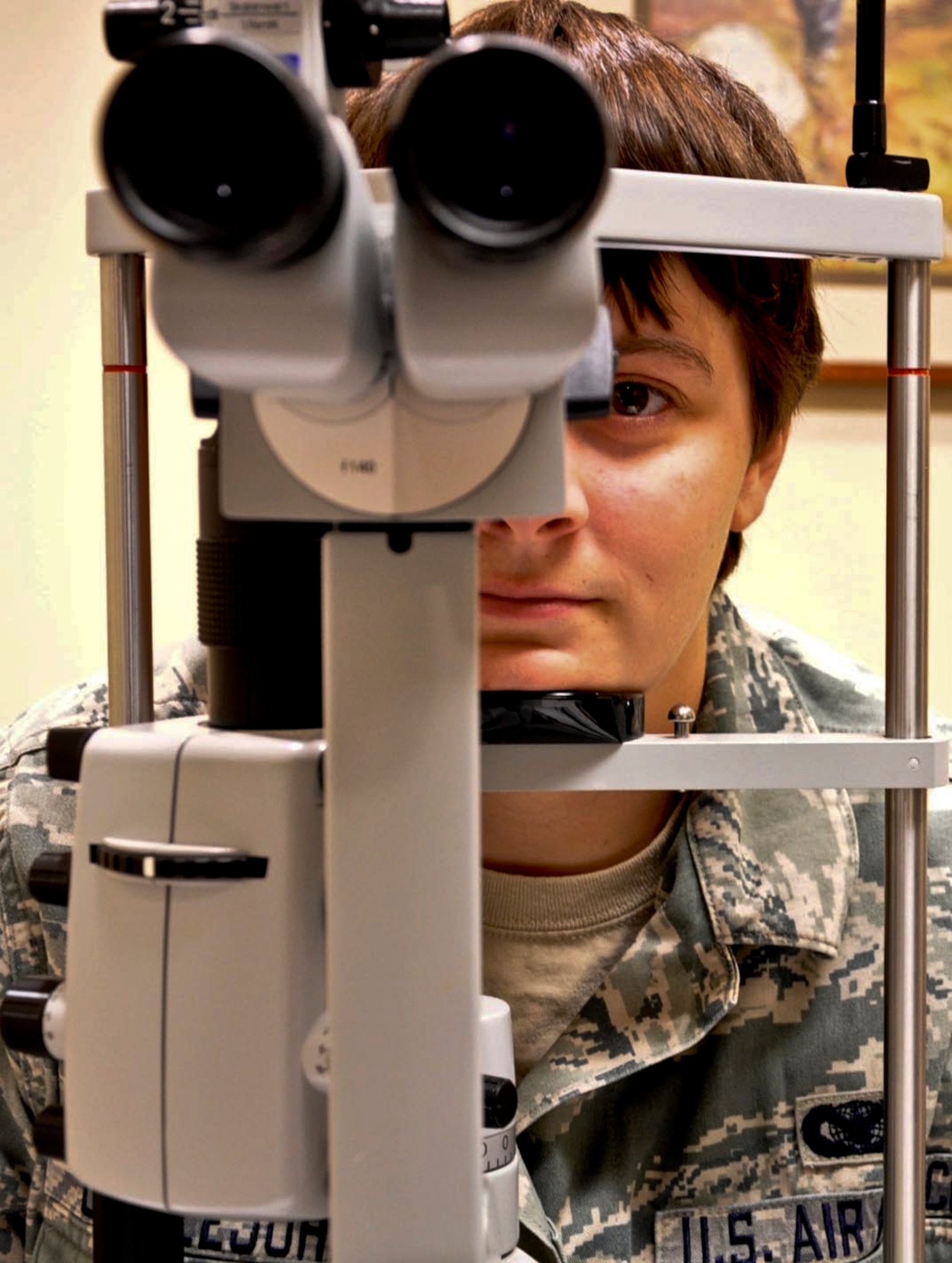 AURORA, Colo. – Senior Airman Megan Littlejohn, 460th Security Forces Squadron, gets her eyes examined Sept. 5, 2012, at the Buckley Air Force Base Optometry Clinic. Besides basic eye exams, the optometry clinic also conducts basic eye exams, fits people for glasses, trains on contact lens use, and offers pre- and post-operative care after refractive surgery. (U.S. Air Force photo by Staff Sgt. Kali L. Gradishar)