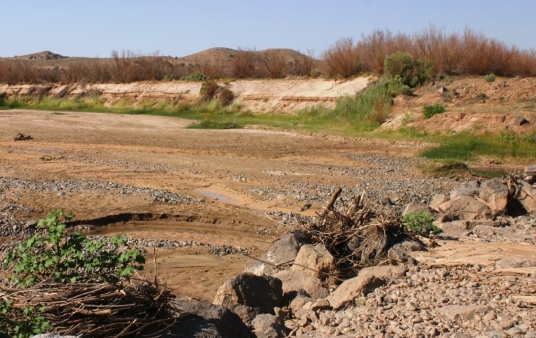 Downstream, the channel has degraded leaving a large drop from the top of the apron to the bottom of the channel.