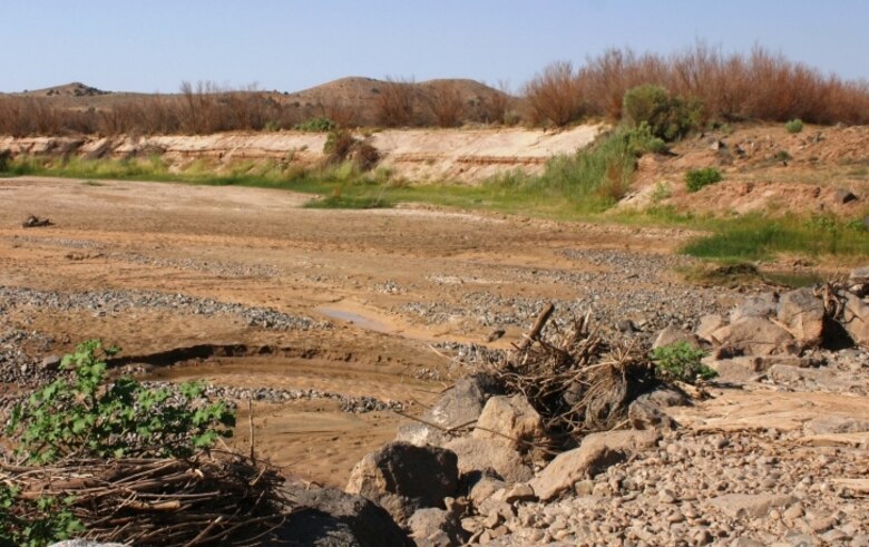 Downstream, the channel has degraded leaving a large drop from the top of the apron to the bottom of the channel.