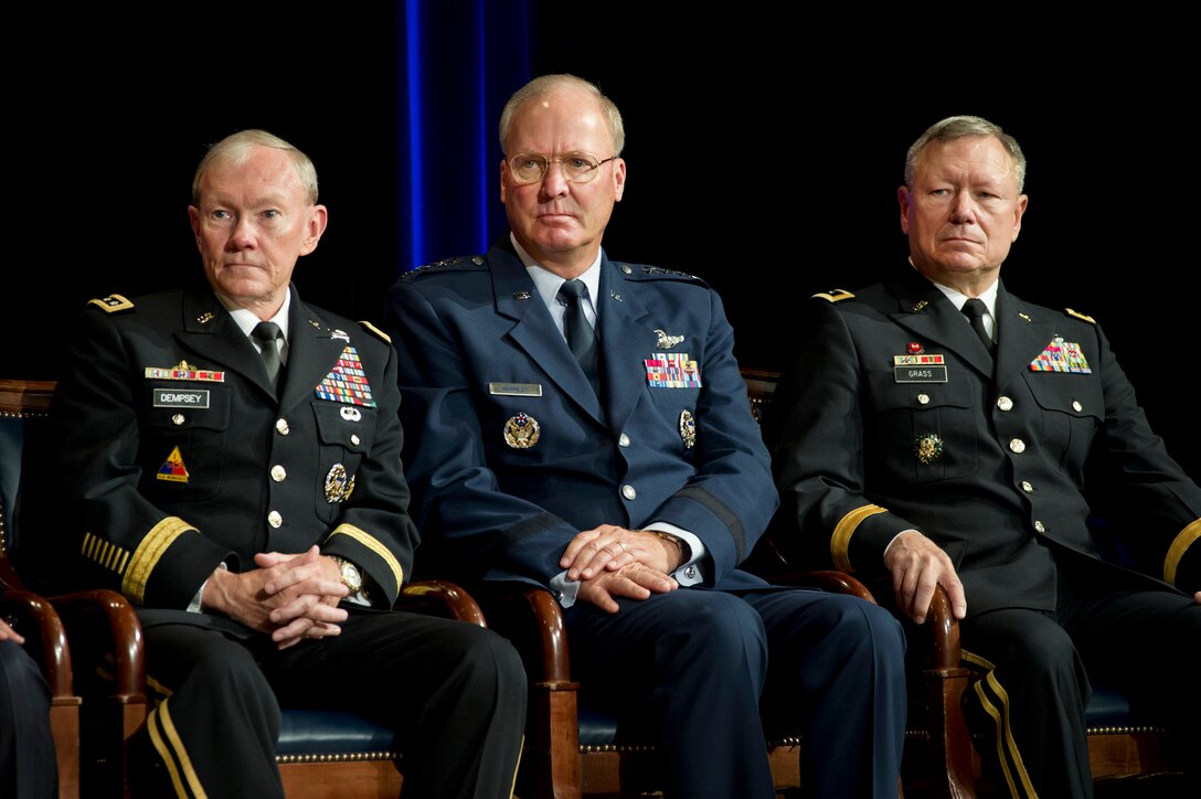 Army Gen. Martin E. Dempsey, chairman of the Joint Chiefs of Staff, Air Force Gen. Craig R. McKinley, outgoing National Guard Bureau chief, and Army Lt. Gen. Frank J. Grass, incoming chief, participate in the change-of-responsibility ceremony for chief at the Pentagon, Sept. 7, 2012.
