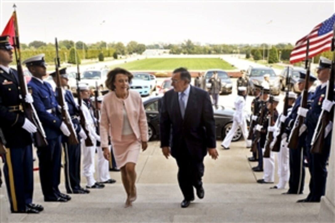 U.S. Defense Secretary Leon E. Panetta escorts Montenegrin Defense Minister Milica Pejanovic-Djurisic through an honor cordon into the Pentagon, Sept. 7, 2012. The two defense leaders met to discuss a number of issues including the current transition in Afghanistan and regional relations in Southeast Europe.