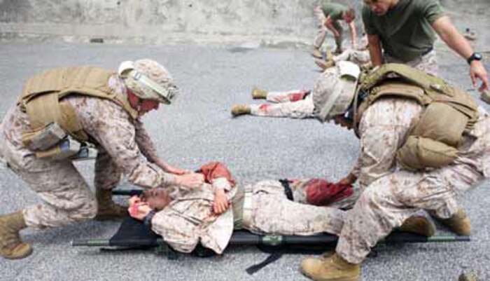 Petty Officer 3rd Class Ryan P. Kierce and Seaman Lilweti White treat a simulated automobile accident
victim during a vehicle-extraction drill as part of a remote pre-hospital trauma and disaster course at the
Royal Darwin Hospital, Australia, Aug. 23. During the two-day course taught by a combination of Australian
firefighters and medical staff, corpsmen received classes in a variety of medical skills including vehicle
extraction, how to treat spinal injuries and fractures, and managing a remote mass-casualty incident. Kierce
and White are corpsmen with shock trauma platoon, 3rd Medical Battalion, 3rd Marine Logistics Group, III
Marine Expeditionary Force, in Australia to support Marine Rotational Force-Darwin.