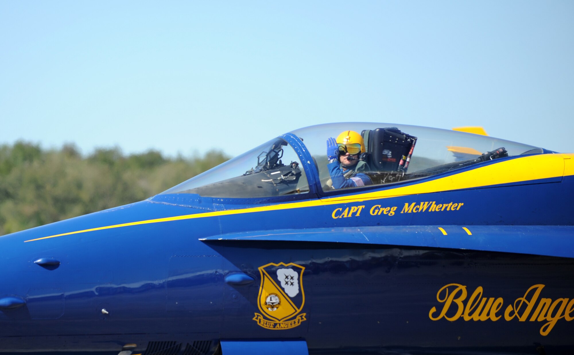 U.S. Navy Capt. Greg McWherter, Blue Angels F/A-18 Super Hornet pilot, waves to the crowd during the 2012 Heritage and Heroes Open House and Air Show Sept. 8, 2012, Little Rock Air Force Base, Ark. The Blue Angels were one of the performers at the Air Show. (U.S. Air Force photo by Staff Sgt. Caleb Pierce) 