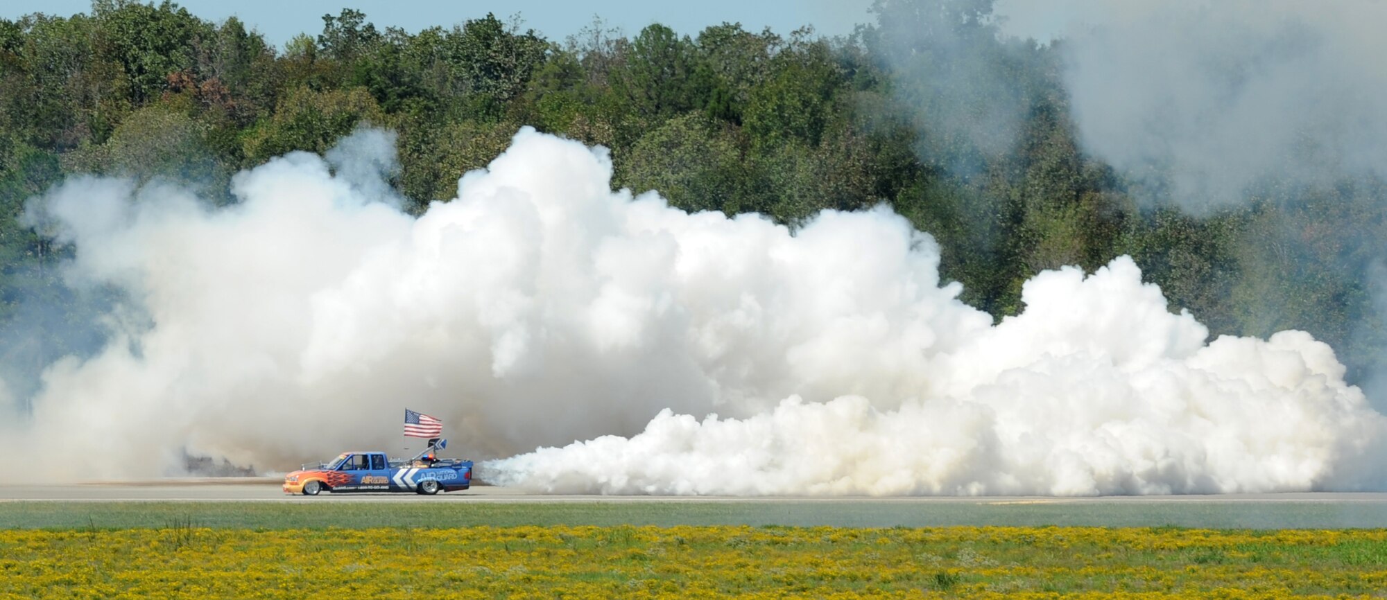 An Air National Guard Flash Fire II Jet Truck puts on a show before racing the runway Sept. 8, 2012, at Little Rock Air Force Base, Ark. This truck is the world’s fastest jet powered truck and has set airshow speed records of 375 miles per hour. (U.S. Air Force photo by Staff Sgt. Caleb Pierce) 