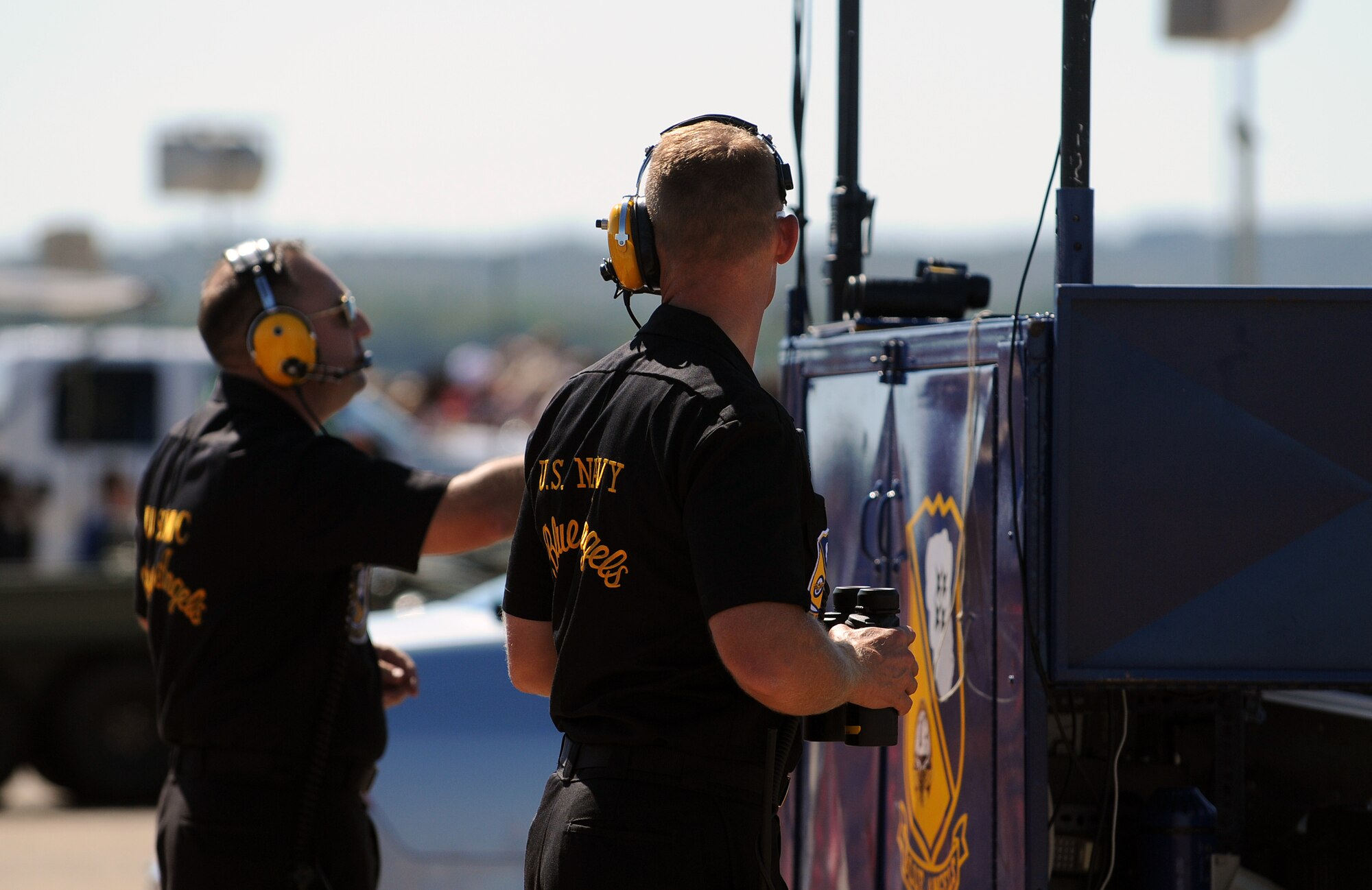 Crew members of the U.S. Navy Blue Angels work behind the scenes during the 2012 Heritage and Heroes Open House and Air Show Sept. 8, 2012, at Little Rock Air Force Base, Ark. The Blue Angels were one of the performers at the air show. (U.S. Air Force photo by Staff Sgt. Jessica Condit)