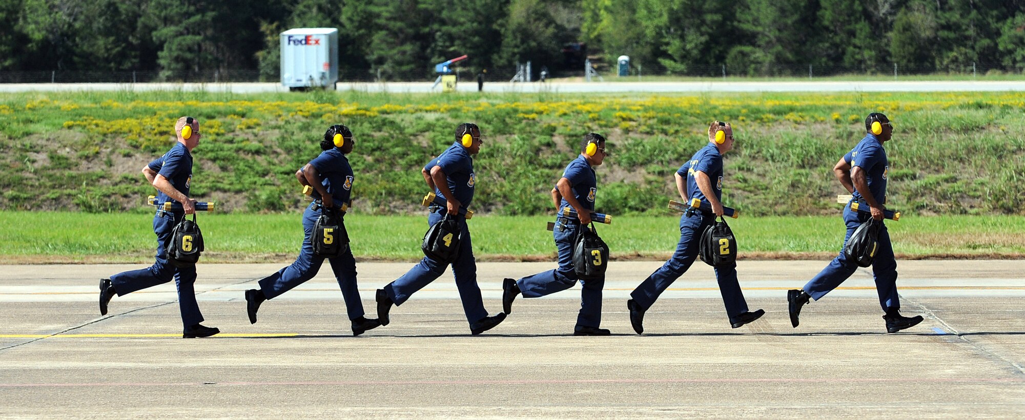 The U.S. Navy Blue Angels crew chiefs prepare the pilots for departure during the 2012 Heritage and Heroes Open House and Air Show Sept. 8, 2012, at Little Rock Air Force Base, Ark. The Blue Angels were one of the performers at the air show. (U.S. Air Force photo by Staff Sgt. Jessica Condit)