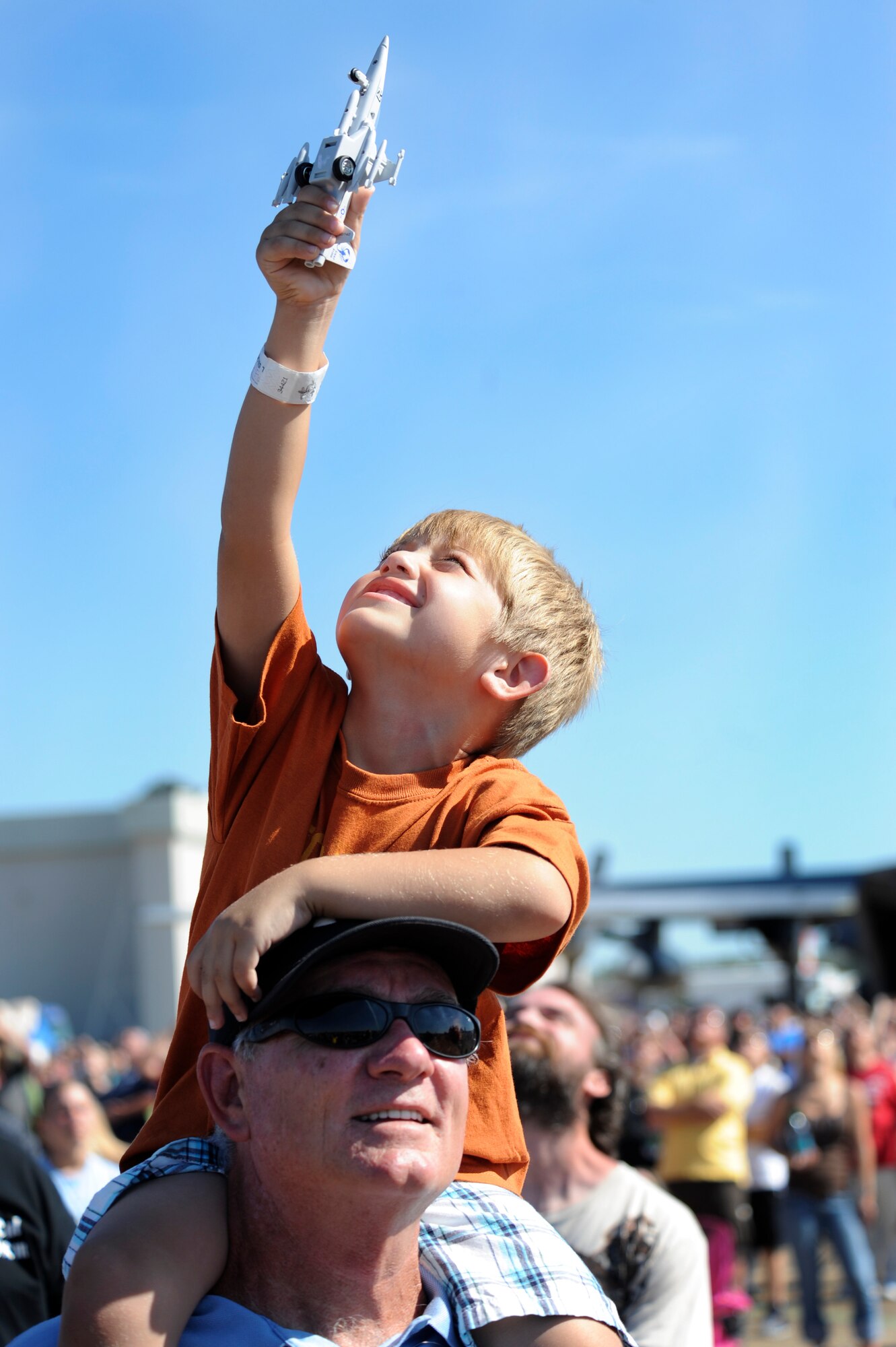 Izak Folsom, grandson of Amberle Folsom, a Laser Eye Center public relations representative, and Jack Bowell, a family friend, watch the U.S. Navy Blue Angels perform during the 2012 Heritage and Heroes Open House and Air Show Sept. 8, 2012, at Little Rock Air Force Base, Ark. The Blue Angels were one of the performers at the air show. (U.S. Air Force photo by Airman 1st Class Rusty Frank)