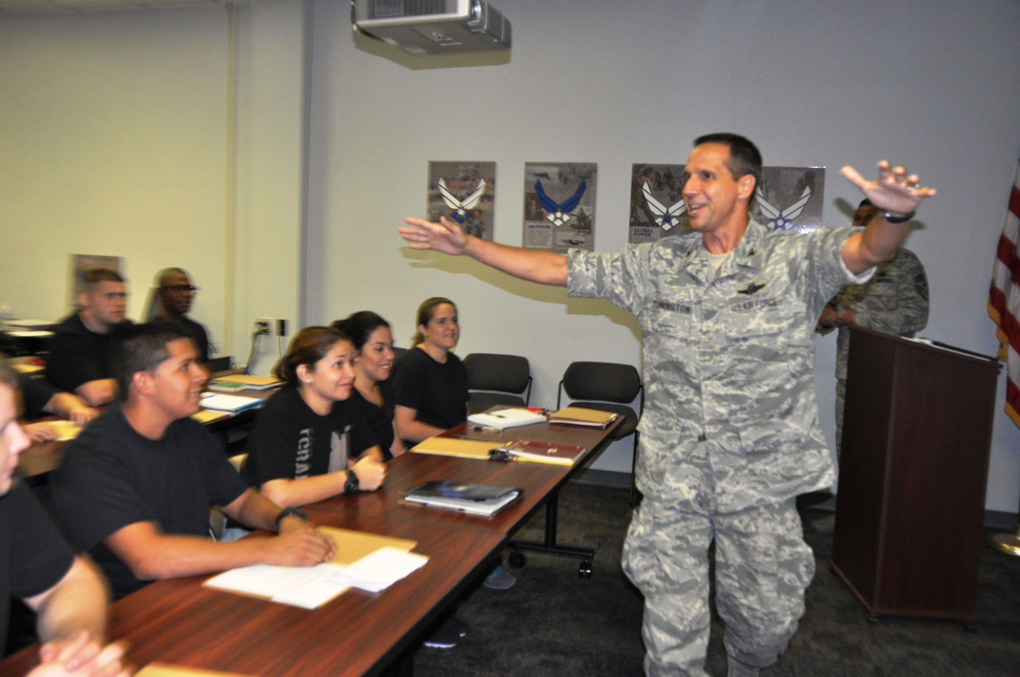 Col. Jeffrey T. Pennington, 433rd Airlift Wing commander, personally greets the first class of the Alamo Wing's Delayed Entry Training Flight on Sept. 8 at Joint Base San Antonio-Lackland, Texas. The flight is designed to assist entrants to the Air Force Reserve with customs and courtesies prior to Basic Military Training.  (U.S. Air Force photo/Tech. Sgt. Carlos J. Trevino)